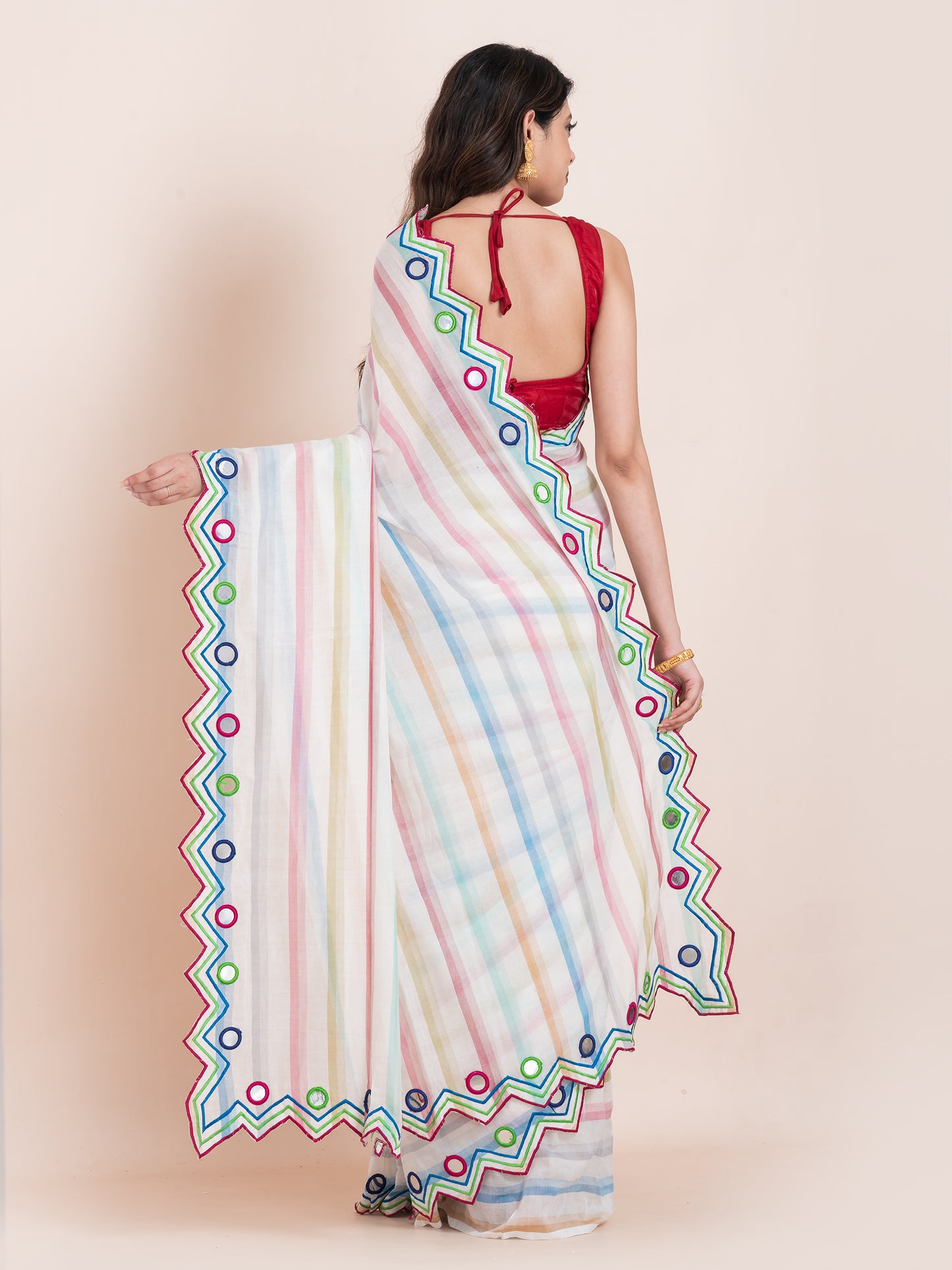 Lightweight white mulmul cotton saree with mirror embroidery and multicolored stripes. Perfect for summer wear, festive looks, and effortless elegance.