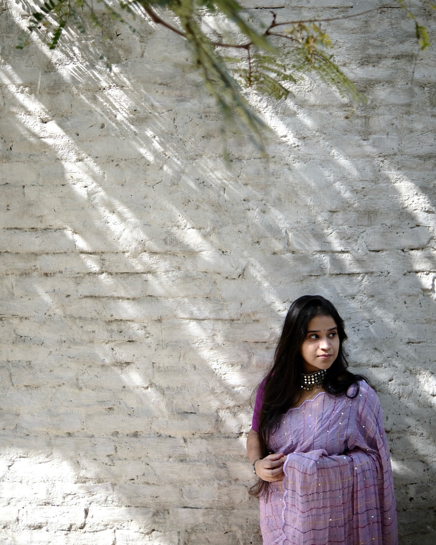 Soft and comfortable mulmul cotton saree with multicoloured embroidery in Kantha Stitch embellished with sequins perfect for party or festive occasion in purple or violet or mauve or lavender