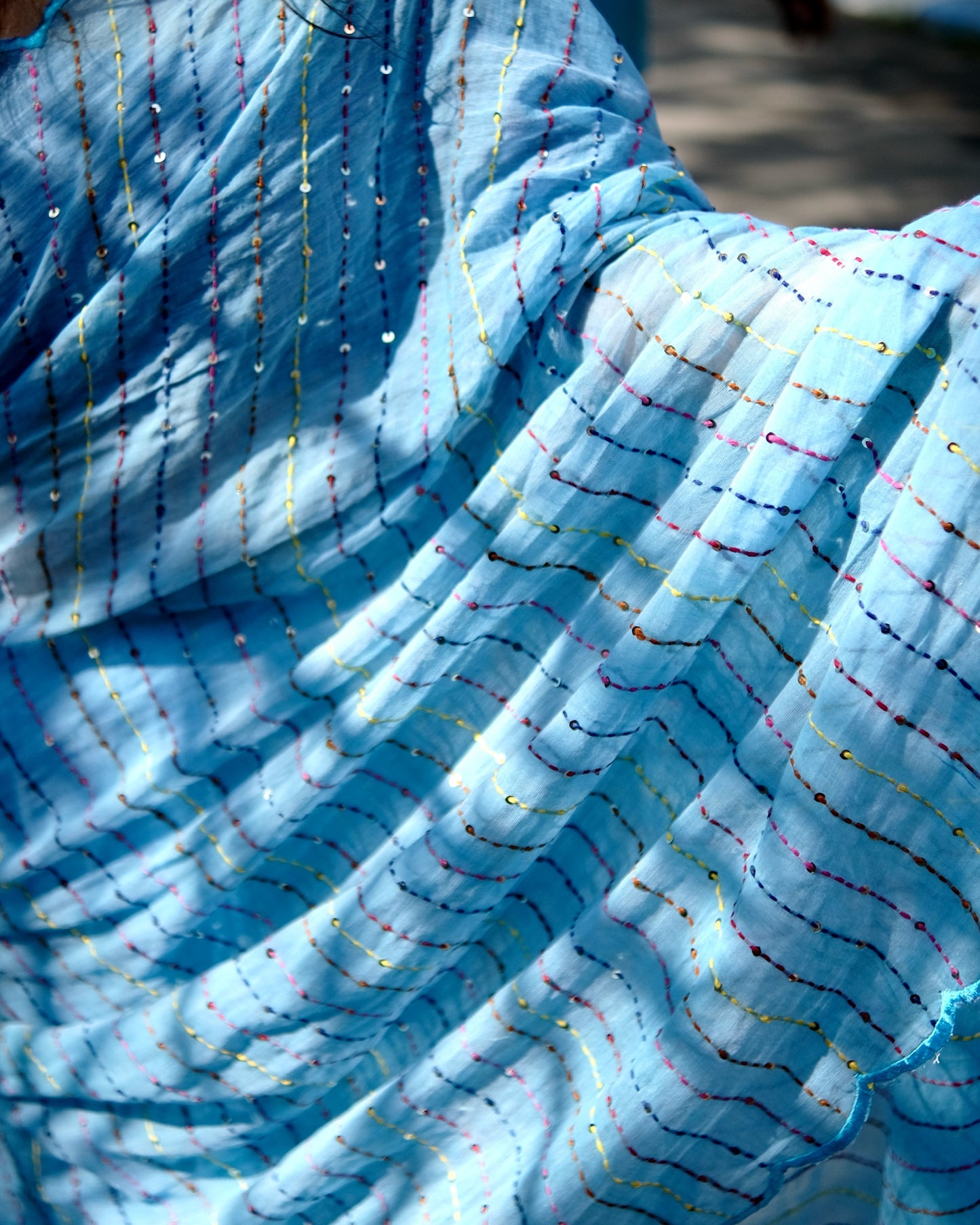 Soft and comfortable mulmul cotton saree with multicoloured embroidery in Kantha Stitch embellished with sequins perfect for party or festive occasion in sky blue
