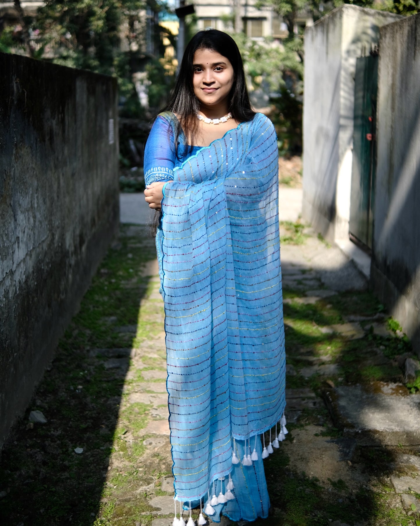 Soft and comfortable mulmul cotton saree with multicoloured embroidery in Kantha Stitch embellished with sequins perfect for party or festive occasion in sky blue