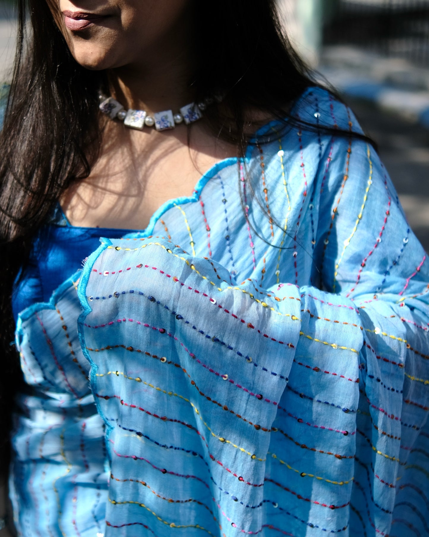 Soft and comfortable mulmul cotton saree with multicoloured embroidery in Kantha Stitch embellished with sequins perfect for party or festive occasion in sky blue