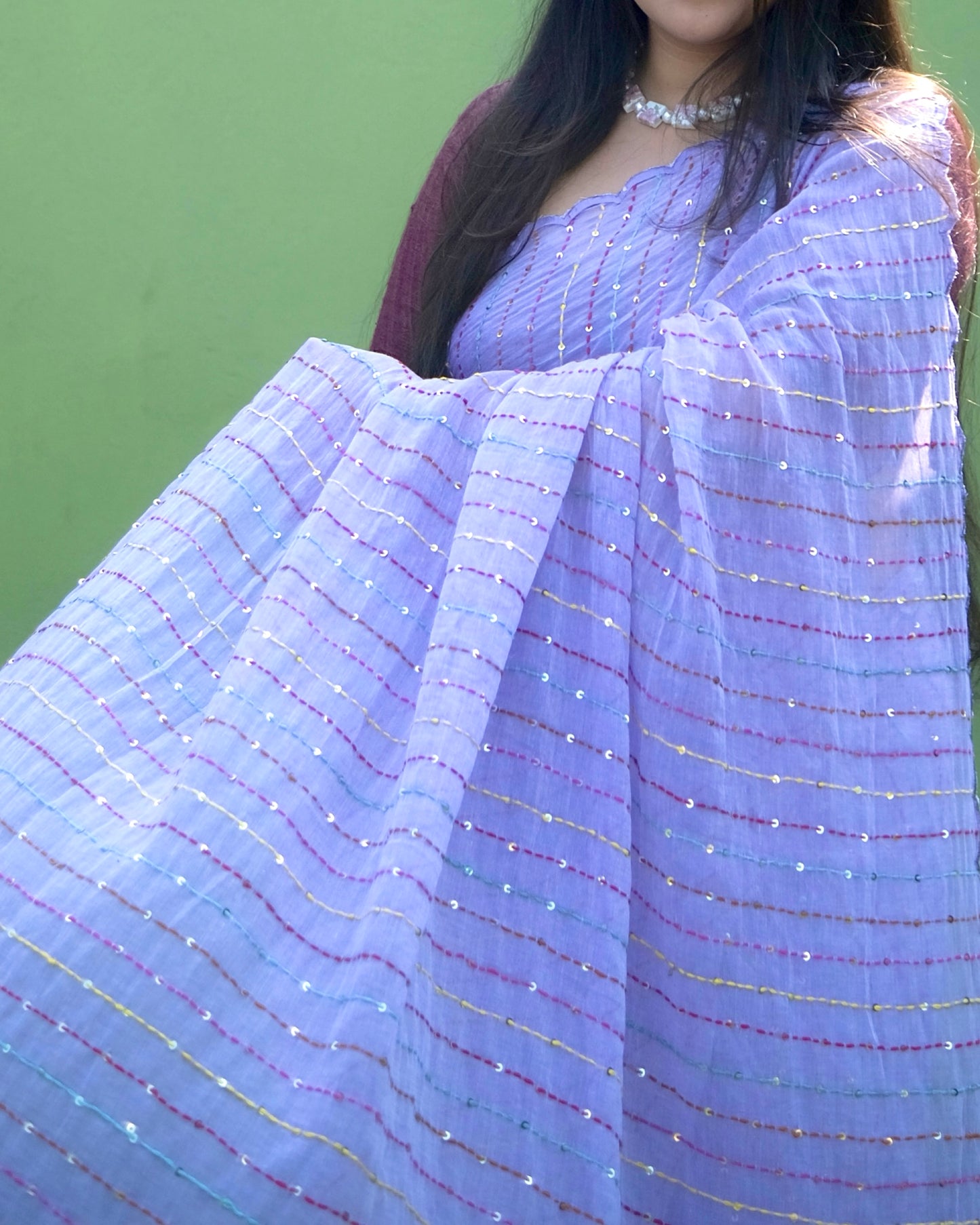 Soft and comfortable mulmul cotton saree with multicoloured embroidery in Kantha Stitch embellished with sequins perfect for party or festive occasion in purple or violet or mauve or lavender