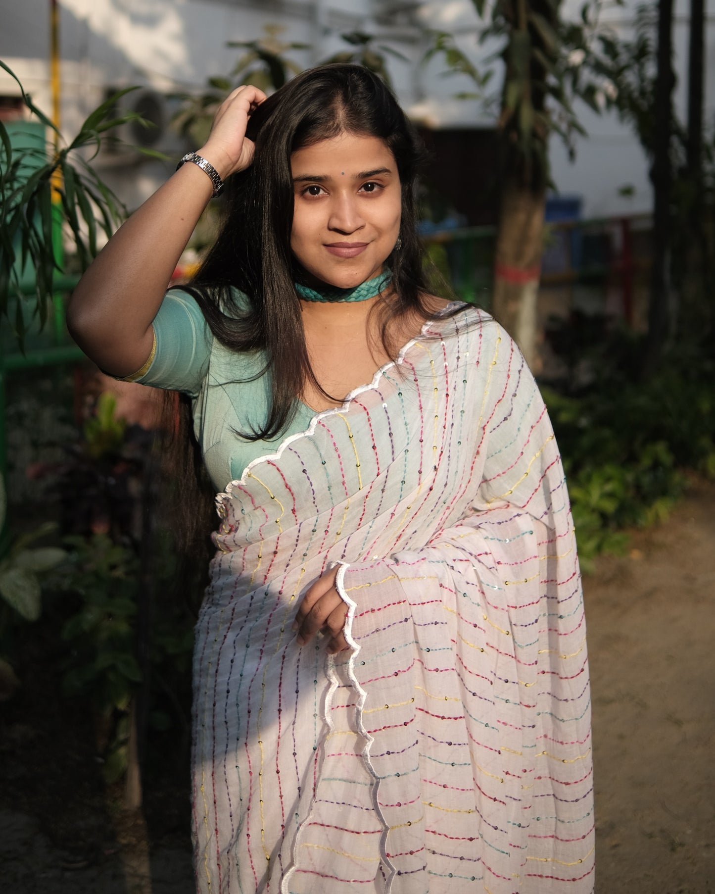 Soft and comfortable mulmul cotton saree with multicoloured embroidery in Kantha Stitch embellished with sequins perfect for party or festive occasion in white