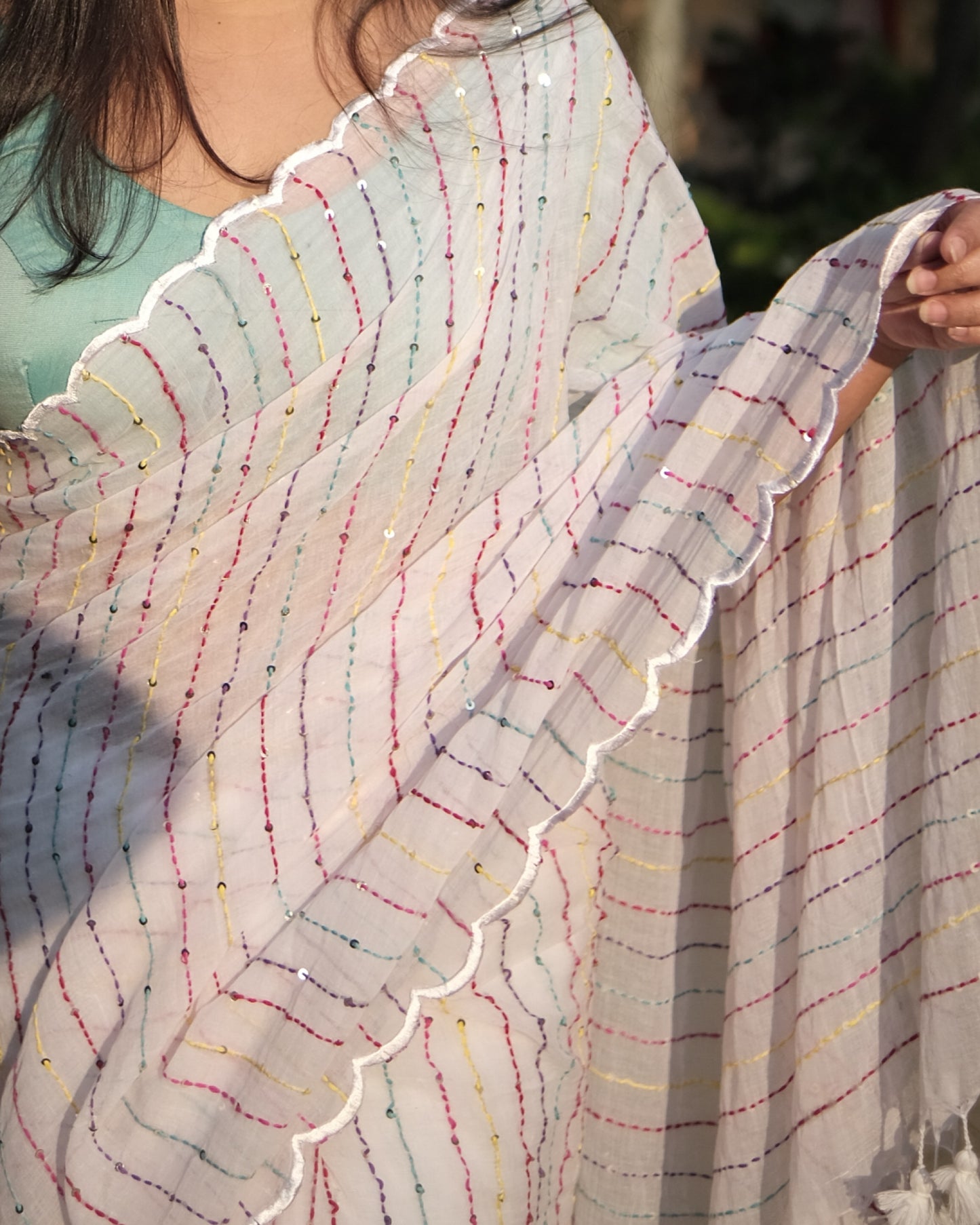 Soft and comfortable mulmul cotton saree with multicoloured embroidery in Kantha Stitch embellished with sequins perfect for party or festive occasion in white