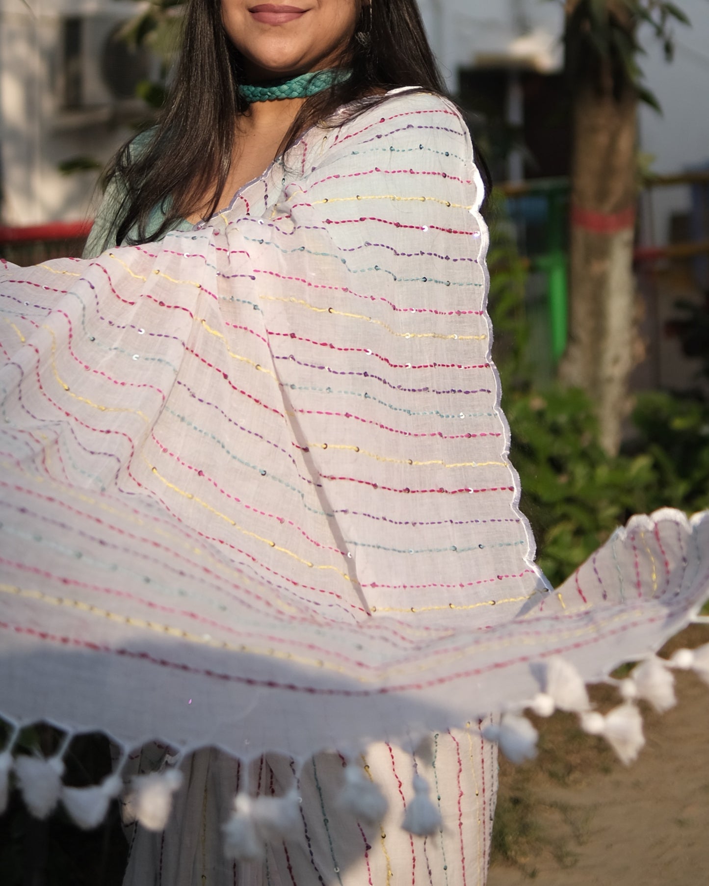 Soft and comfortable mulmul cotton saree with multicoloured embroidery in Kantha Stitch embellished with sequins perfect for party or festive occasion in white