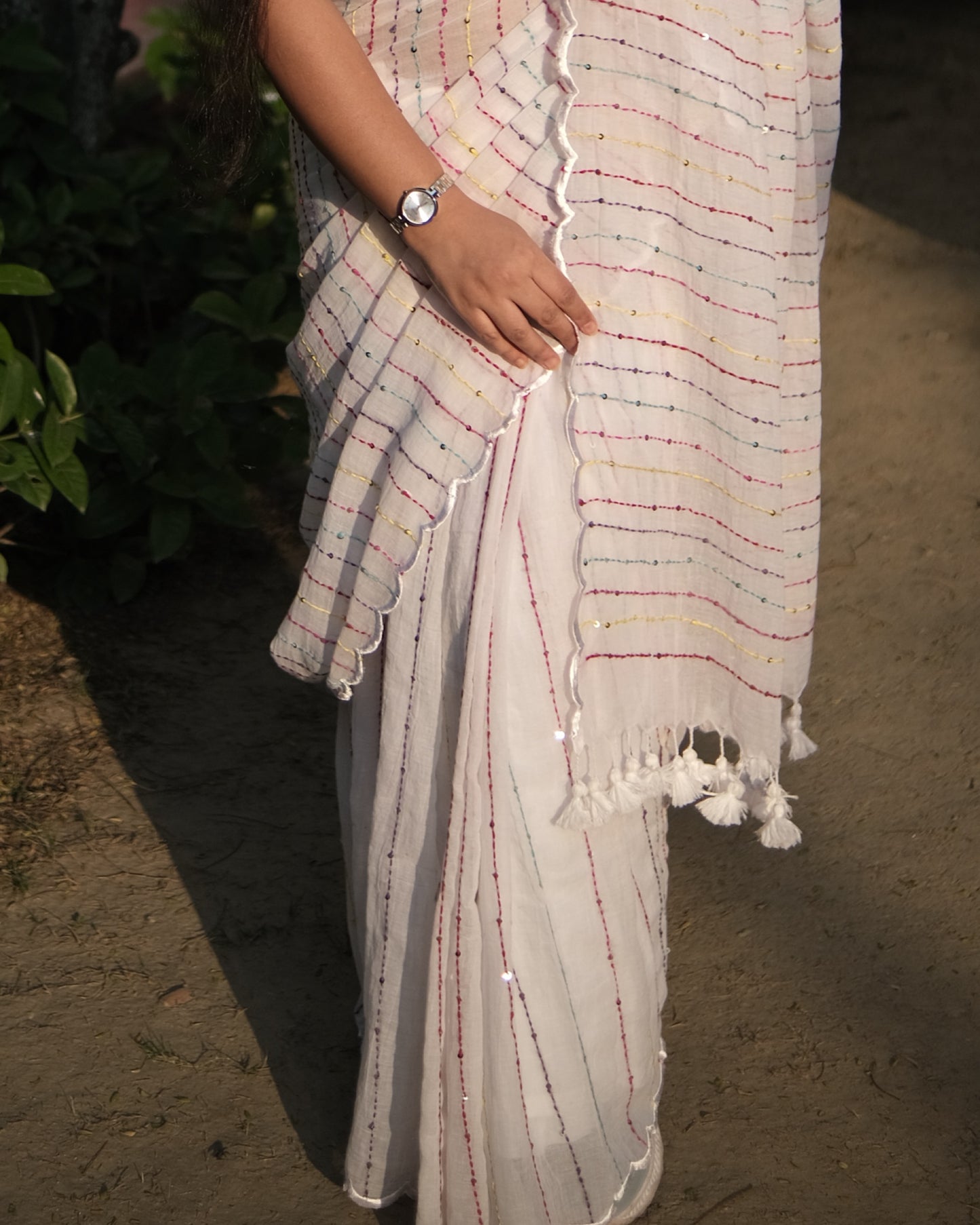 Soft and comfortable mulmul cotton saree with multicoloured embroidery in Kantha Stitch embellished with sequins perfect for party or festive occasion in white