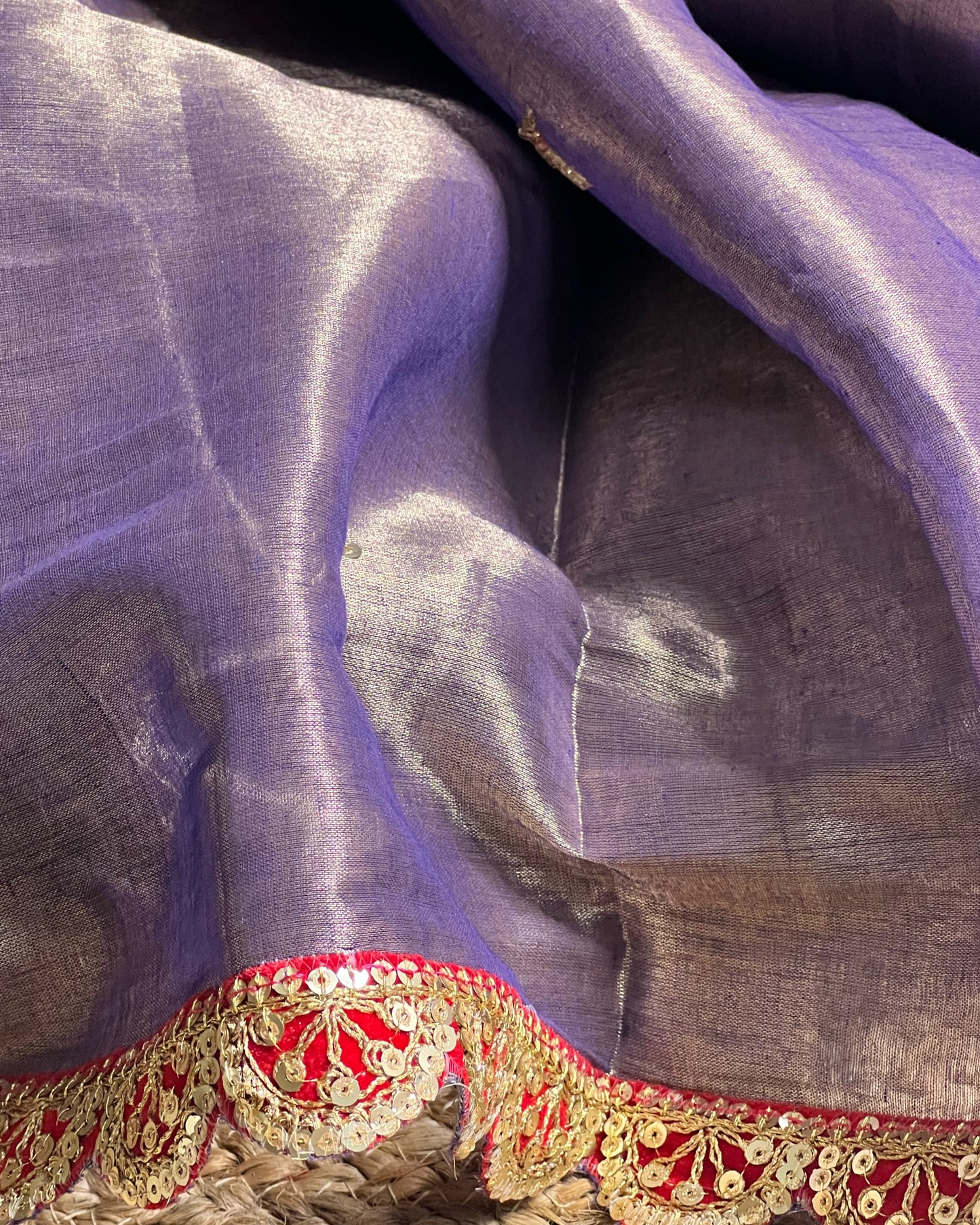Mulmul Tissue Festive/Party Wear saree for the wedding season in lavender / purple / violet colour with red Sari border and Zardozi/Jarsousi work on entire saree, metallic finish
