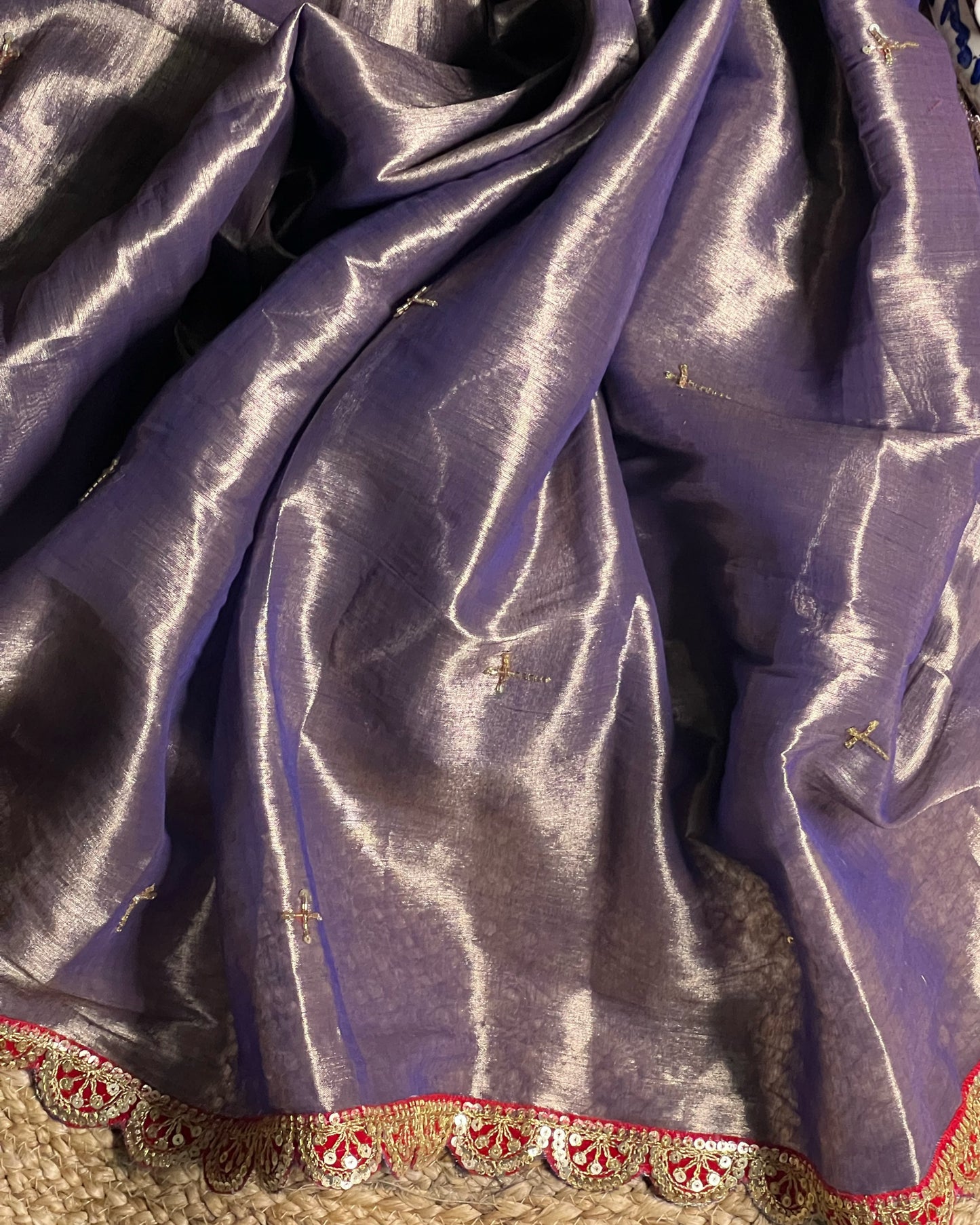 Mulmul Tissue Festive/Party Wear saree for the wedding season in lavender / purple / violet colour with red Sari border and Zardozi/Jarsousi work on entire saree, metallic finish