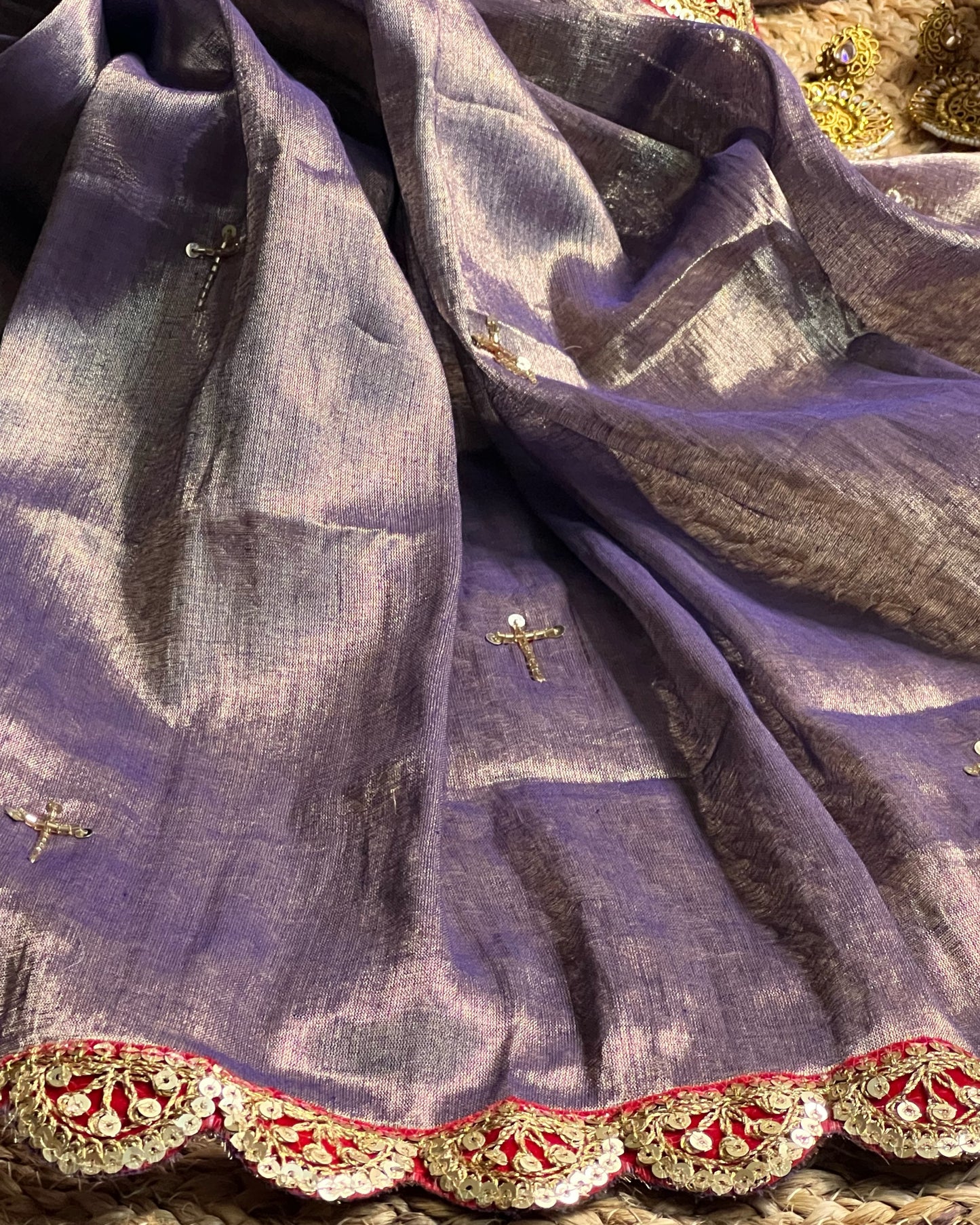 Mulmul Tissue Festive/Party Wear saree for the wedding season in lavender / purple / violet colour with red Sari border and Zardozi/Jarsousi work on entire saree, metallic finish