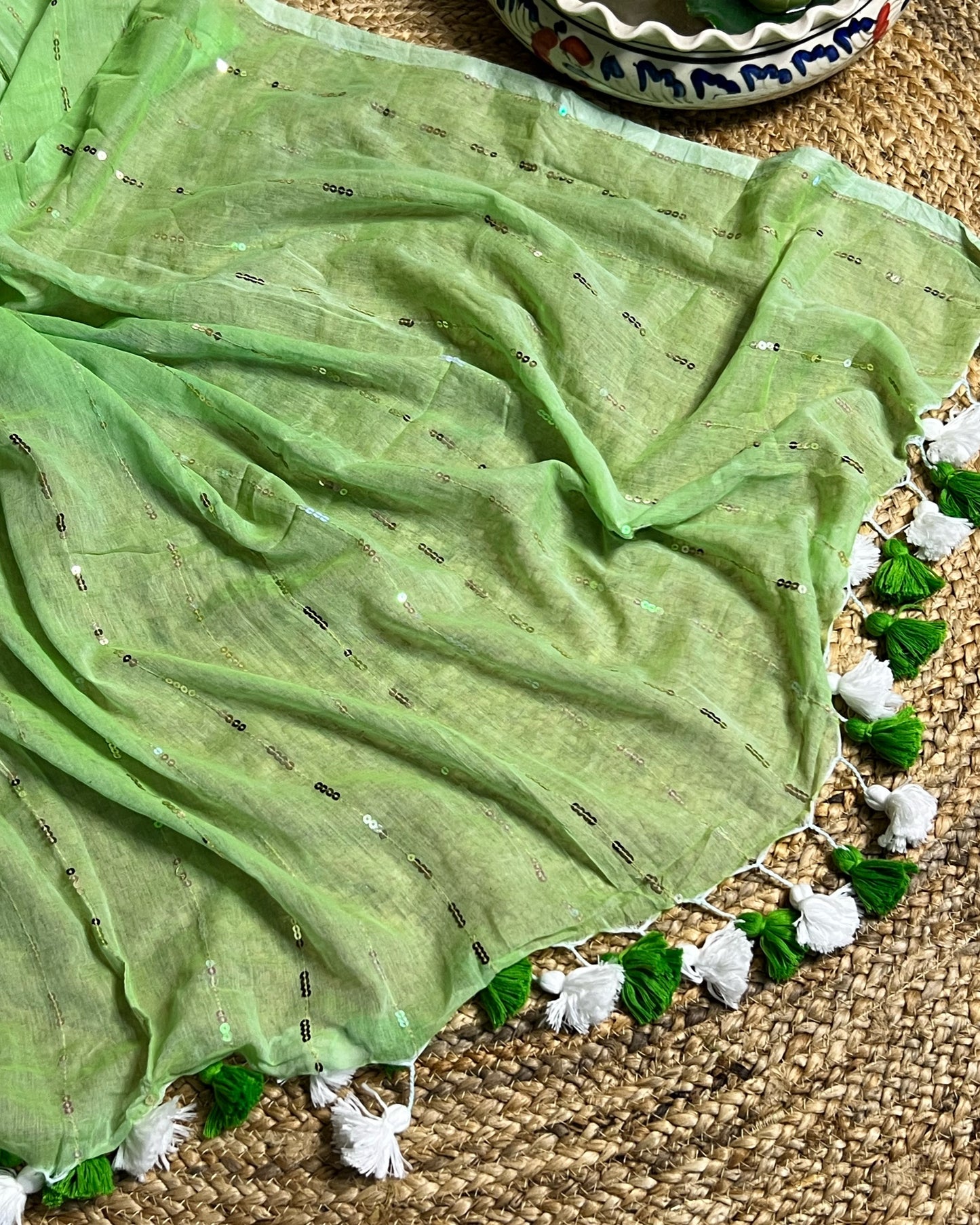 Soft and Comfortable mulmul cotton saree in green shade with sequin emblishment for festive or party wear at reasonable price