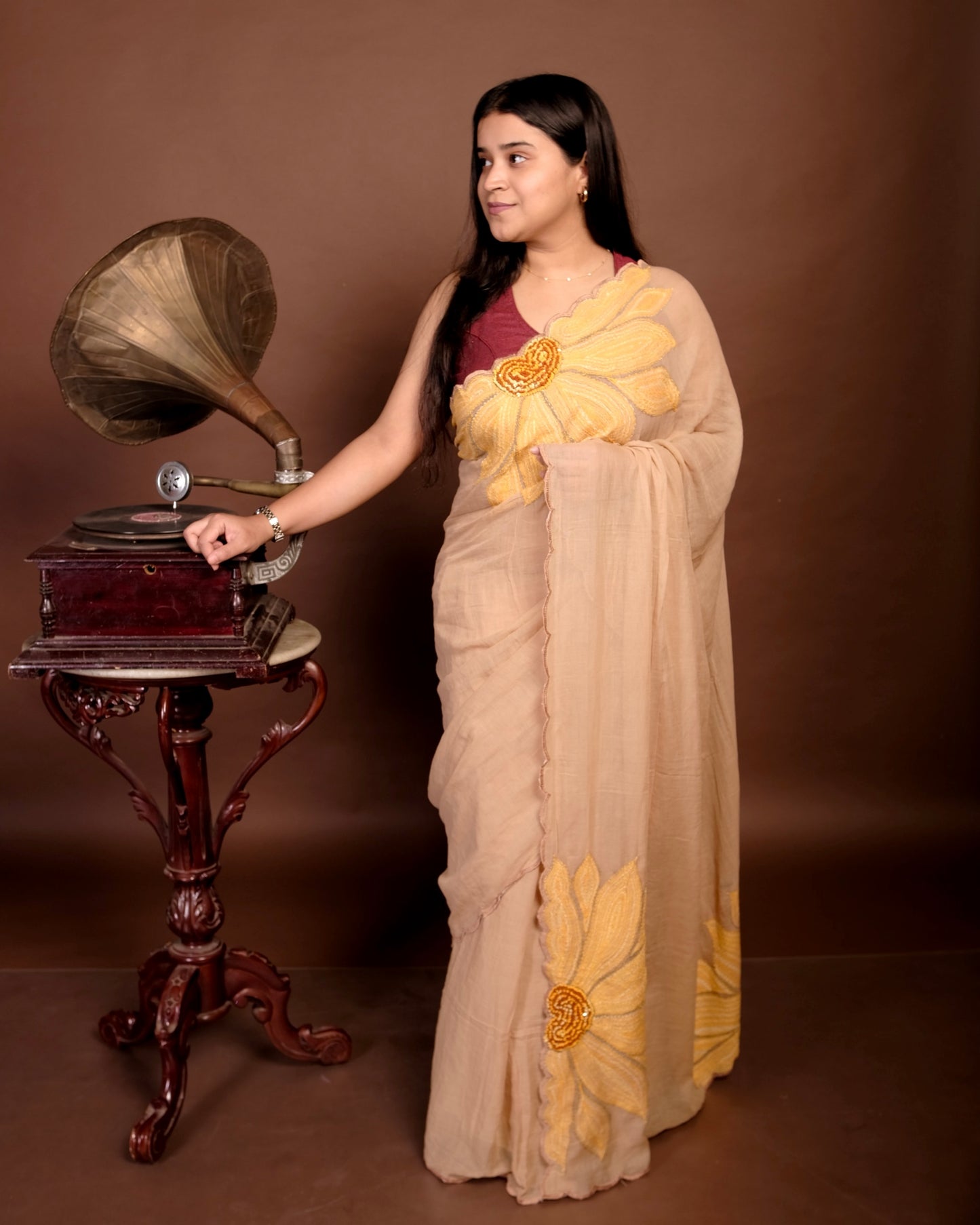 Soft and comfortable light weight beige mulmul cotton saree with sunflower embroidery sequins embellished good for day time wear festive party wear