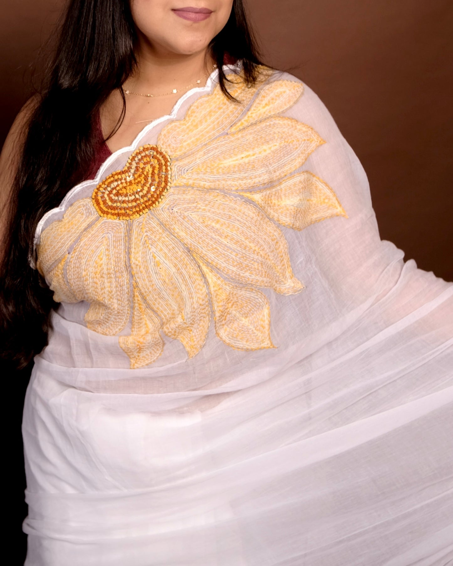 Soft and comfortable light weight white mulmul cotton saree with sunflower embroidery sequins embellished good for day time wear festive party wear