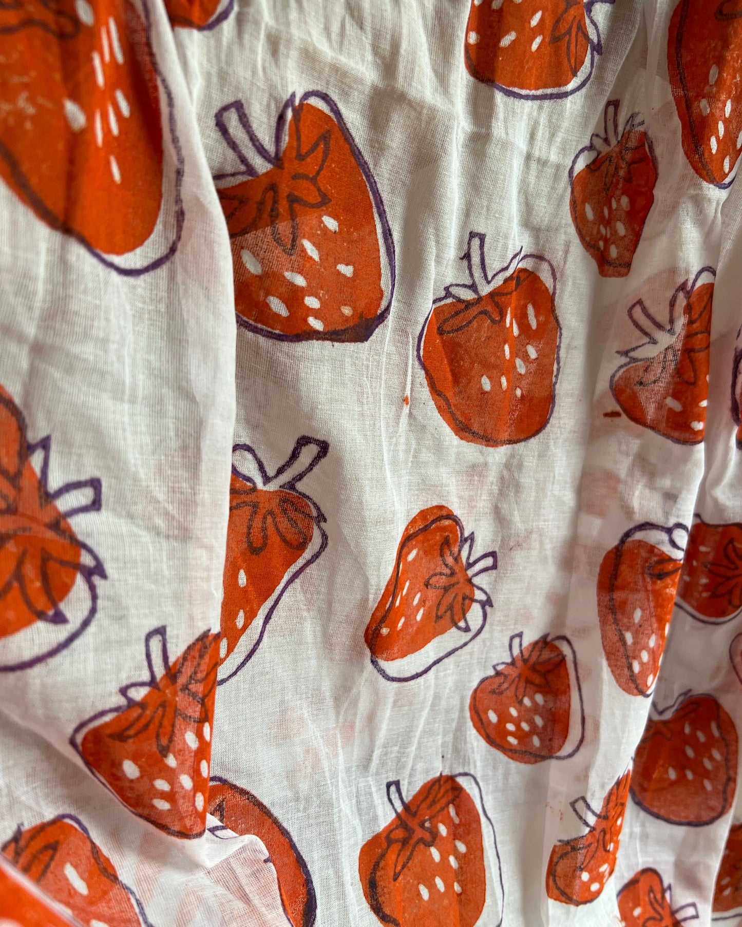 Soft & Comfortable white mulmul saree with handblock print in orange puple strawberry pattern