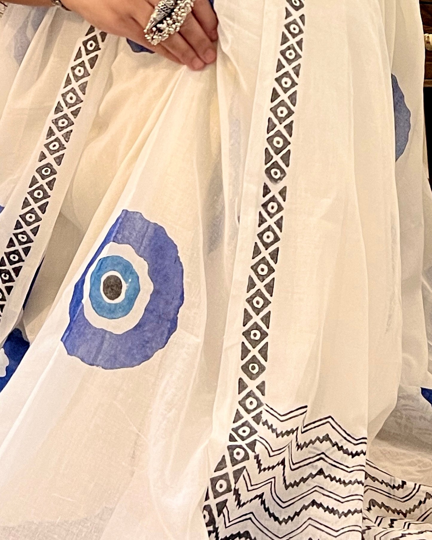 Soft & Comfortable white mulmul saree with handblock print in blue evil eye pattern