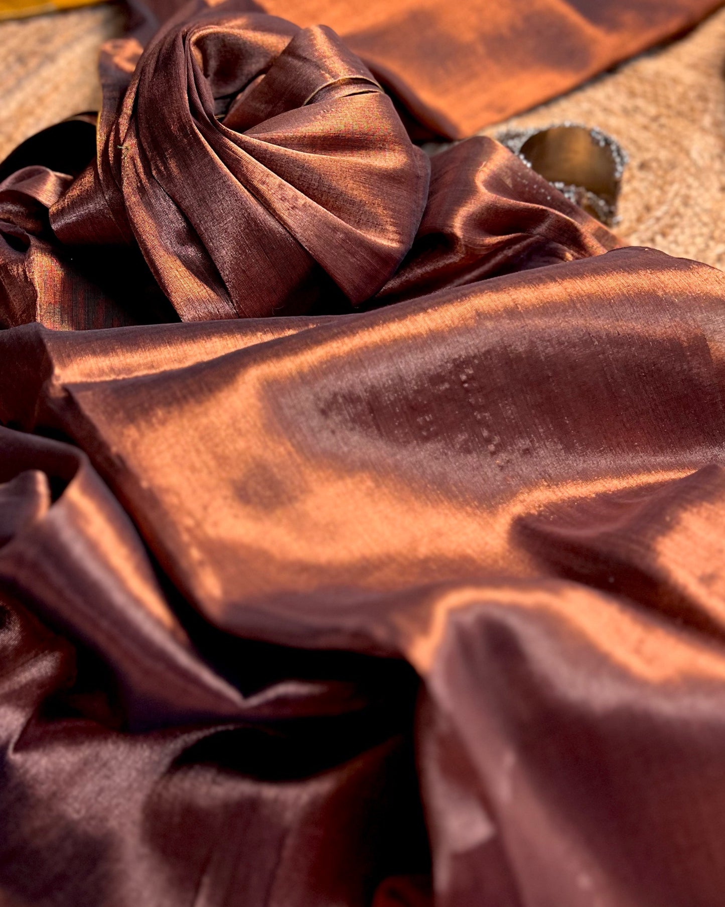 Viral Comfortable tissue saree in metallic golden and copper tones for festive or party wear at reasonable price