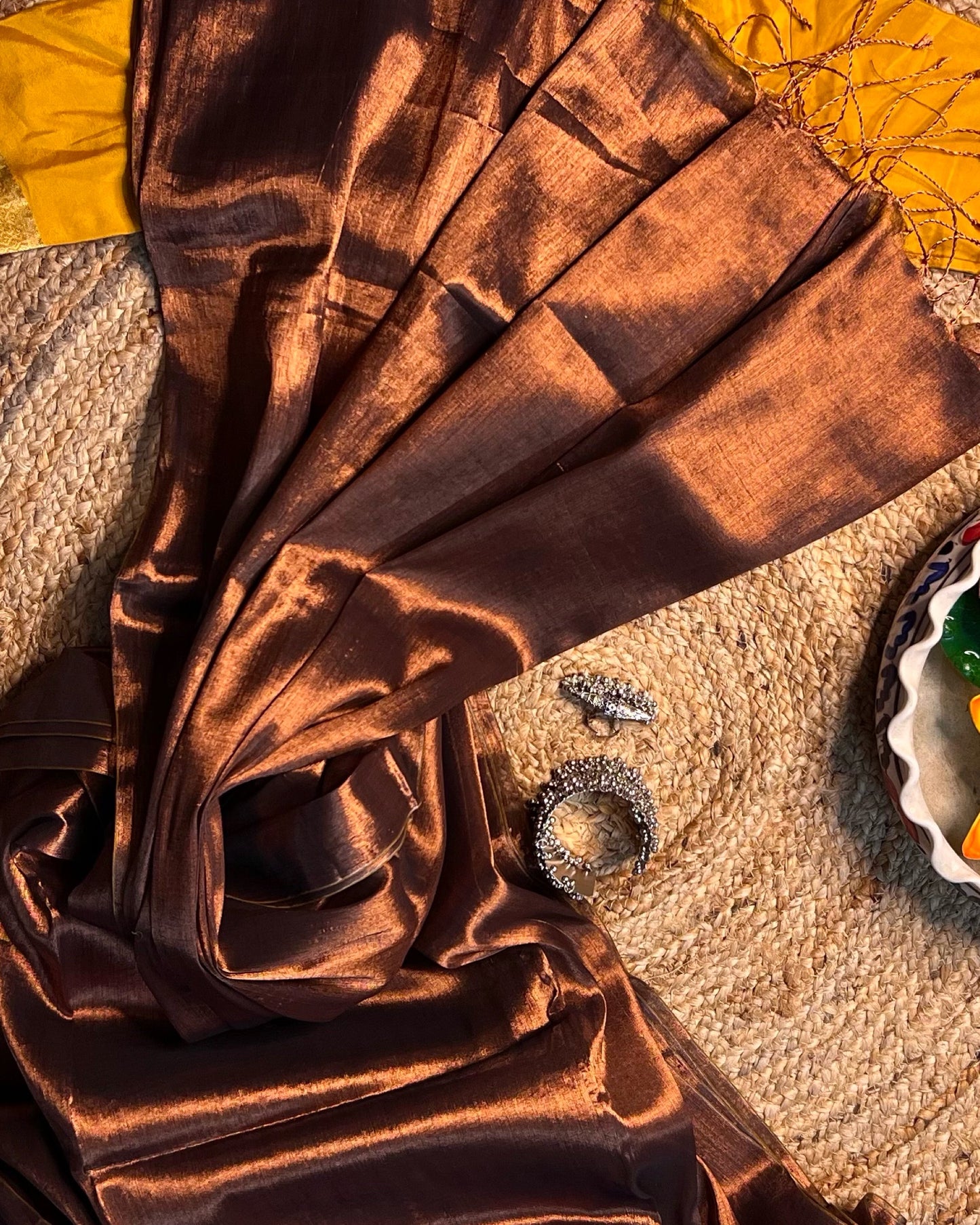 Viral Comfortable tissue saree in metallic golden and copper tones for festive or party wear at reasonable price