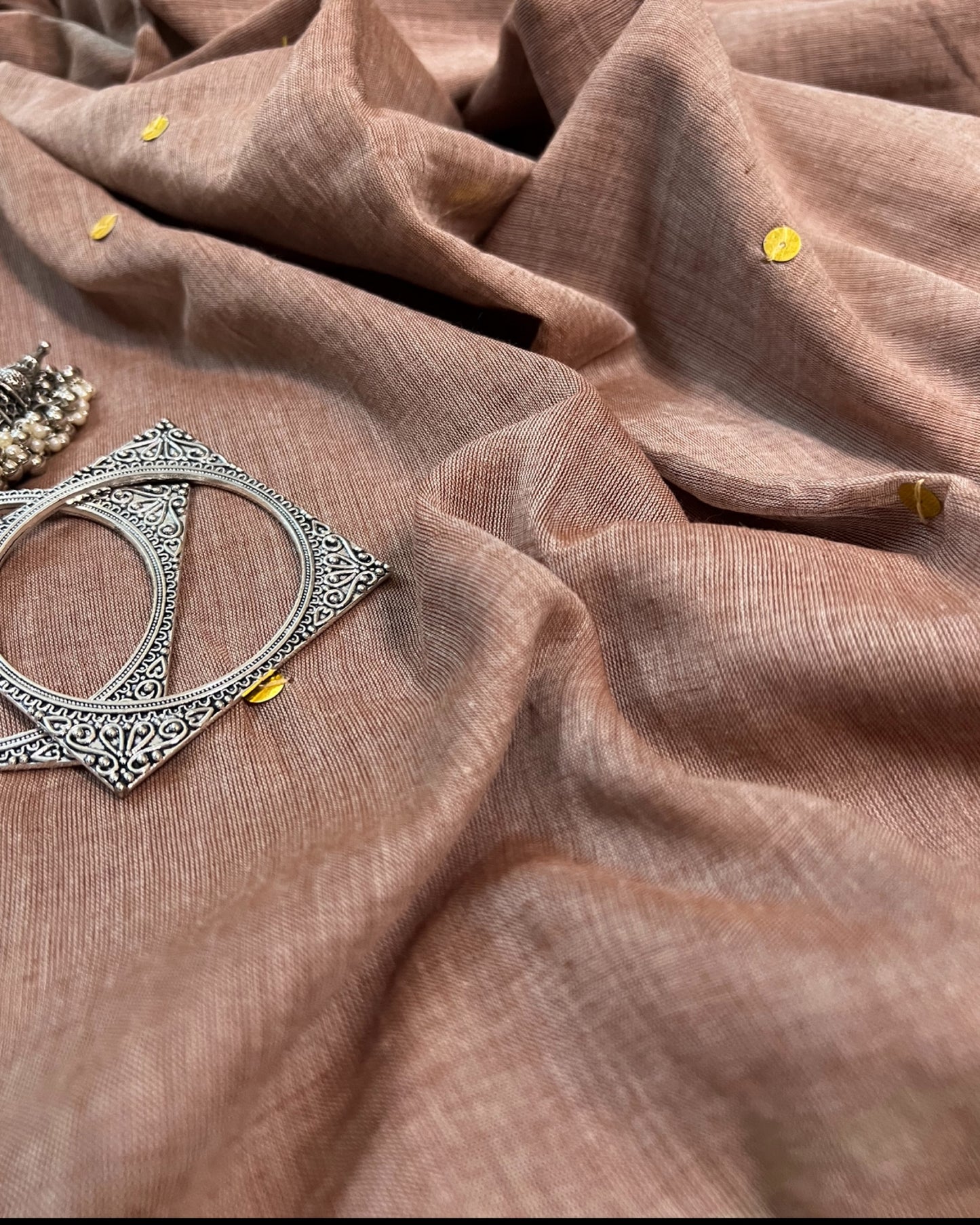 Soft and Comfortable mulmul cotton saree in beige off white brown shade with golden sequin emblishment for festive or party wear at reasonable price