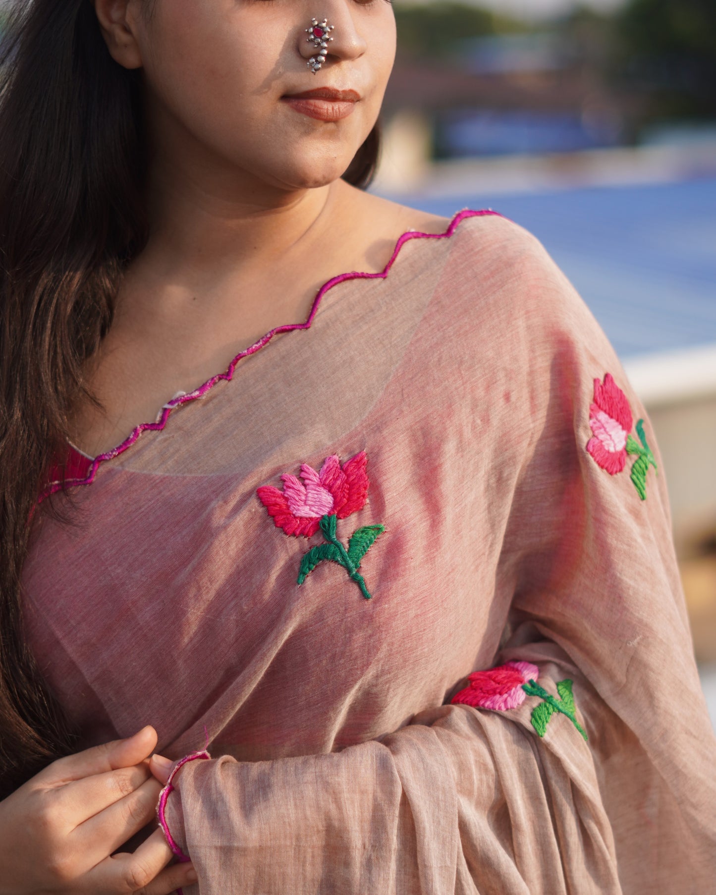 Soft and comfortable light weight beige brown taupe mulmul cotton saree with lotus hand embroidery good for day time wear