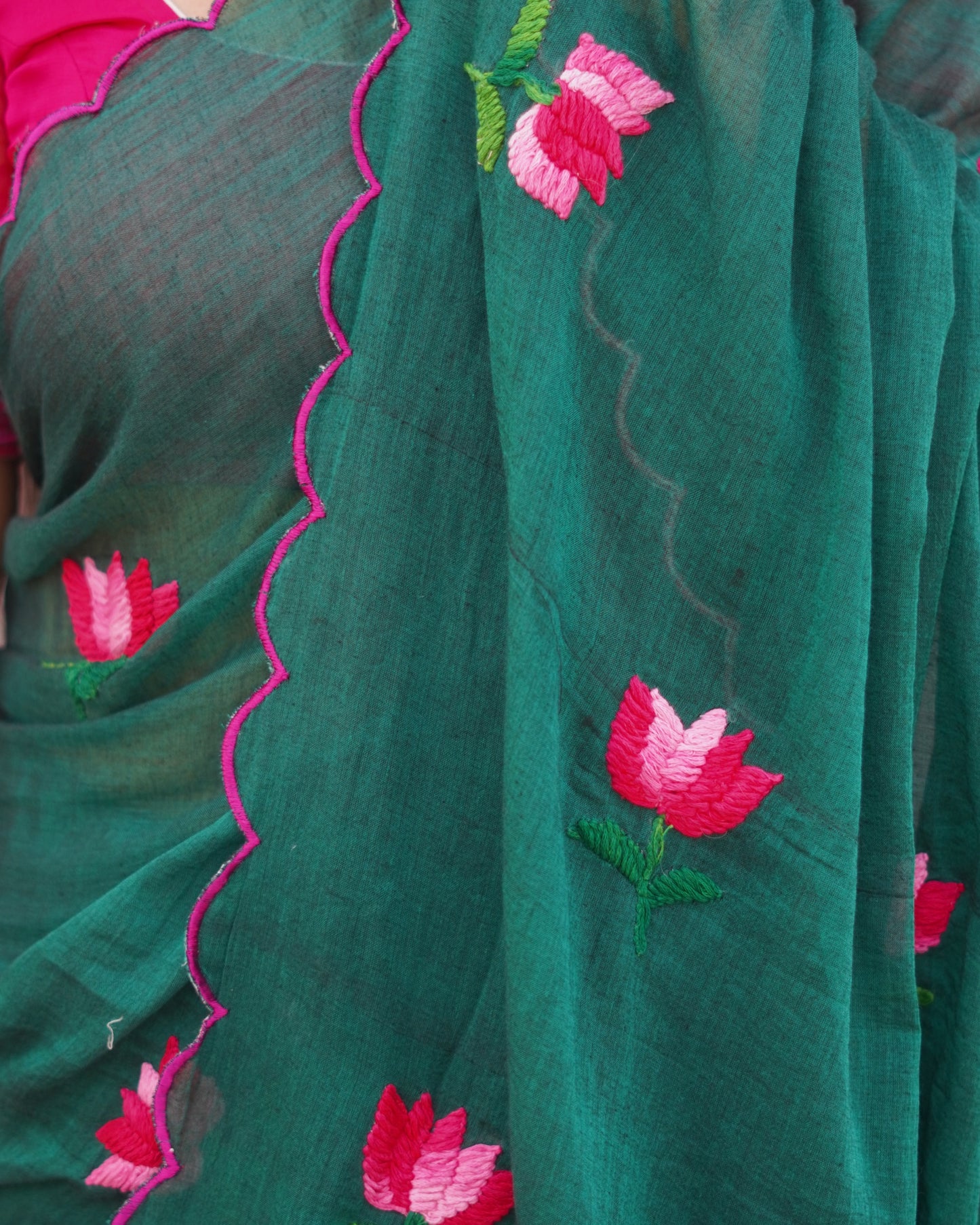 Soft and comfortable light weight emerald dark green mulmul cotton saree with lotus hand embroidery good for day time wear