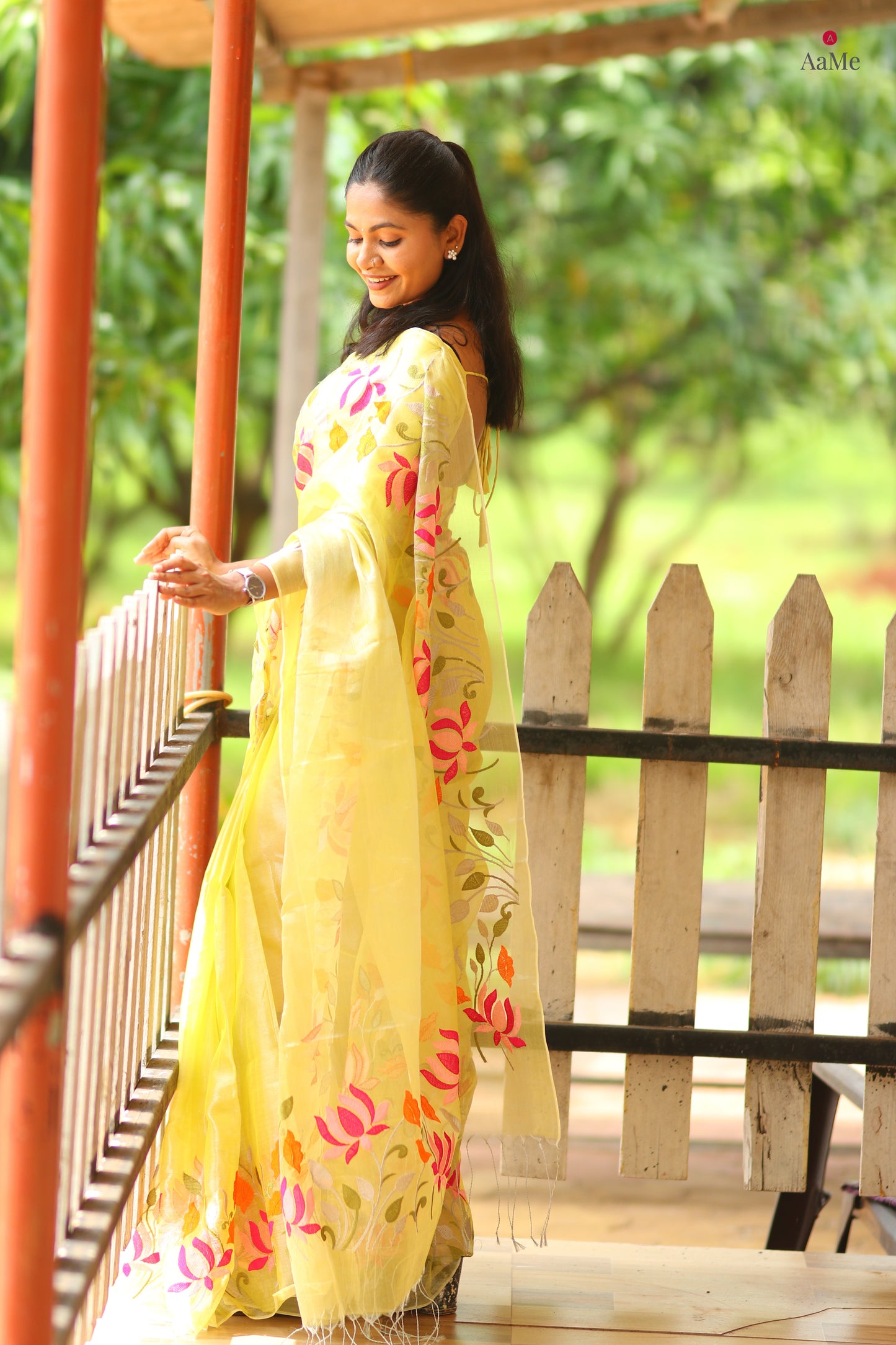 Yellow viral tissue saree with floral embroidery orange and pink