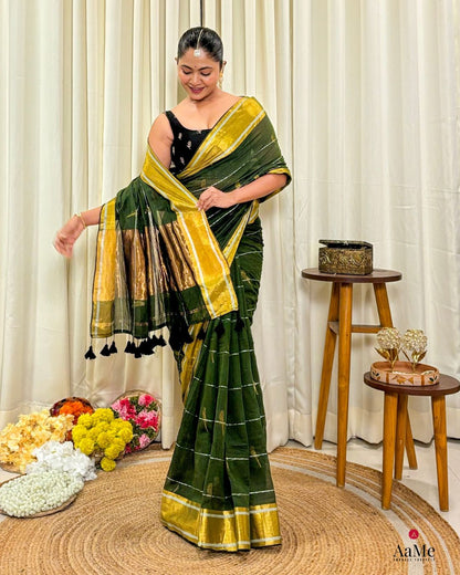Model wearing The Garden Parrot green mulmul cotton saree with soft handloom texture