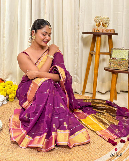 Women wearing handcrafted purple mulmul cotton saree with golden border for elegant daytime occasions