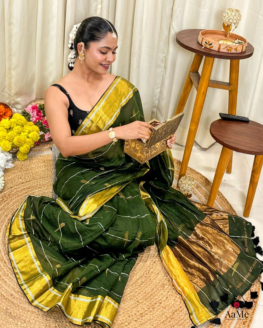 Handwoven green mulmul cotton saree showcasing light and airy summer fabric