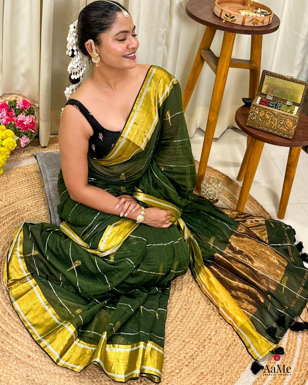 Handwoven green mulmul cotton saree showcasing light and airy summer fabric