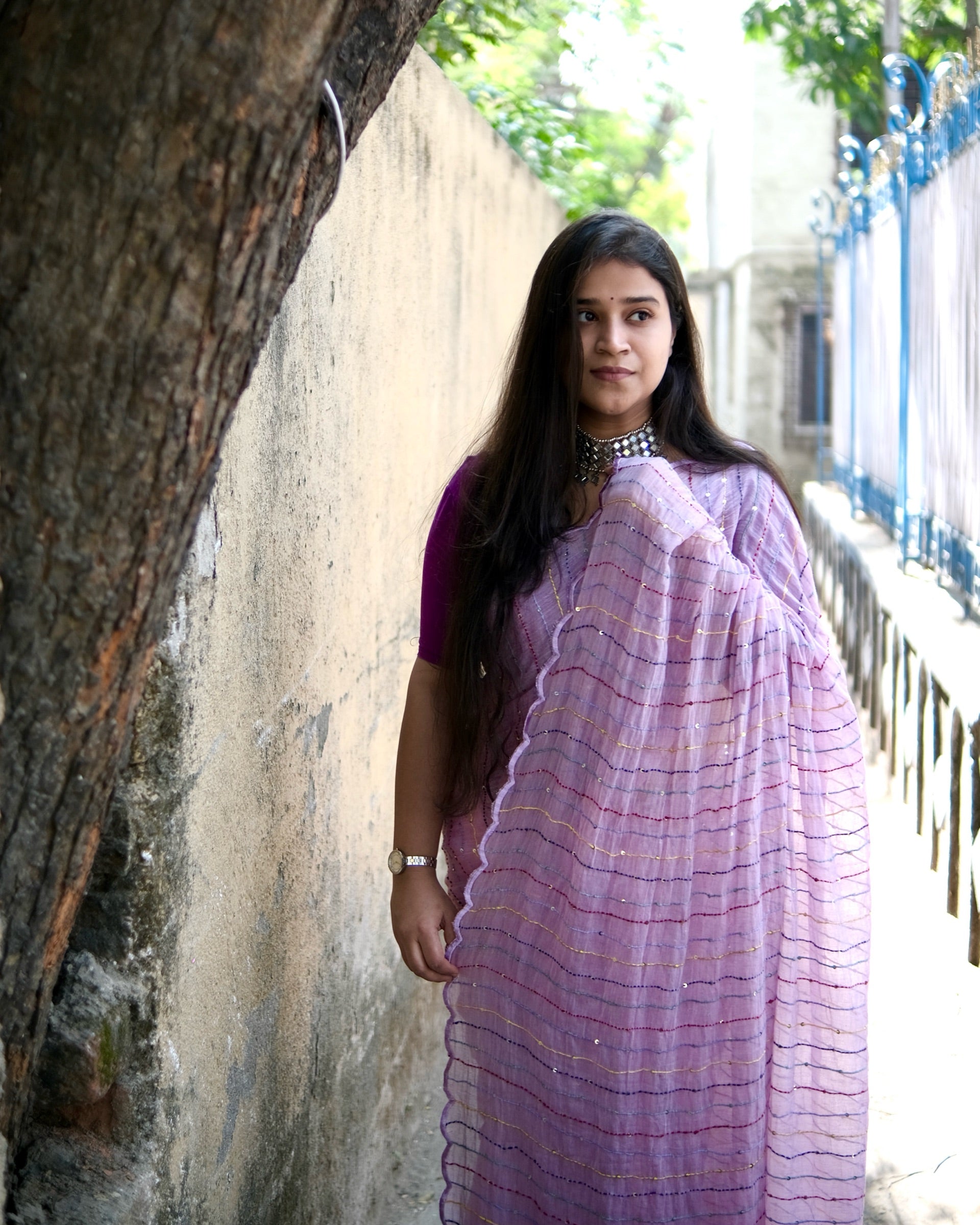 Soft and comfortable mulmul cotton saree with multicoloured embroidery in Kantha Stitch embellished with sequins perfect for party or festive occasion  in purple or violet or mauve or lavender