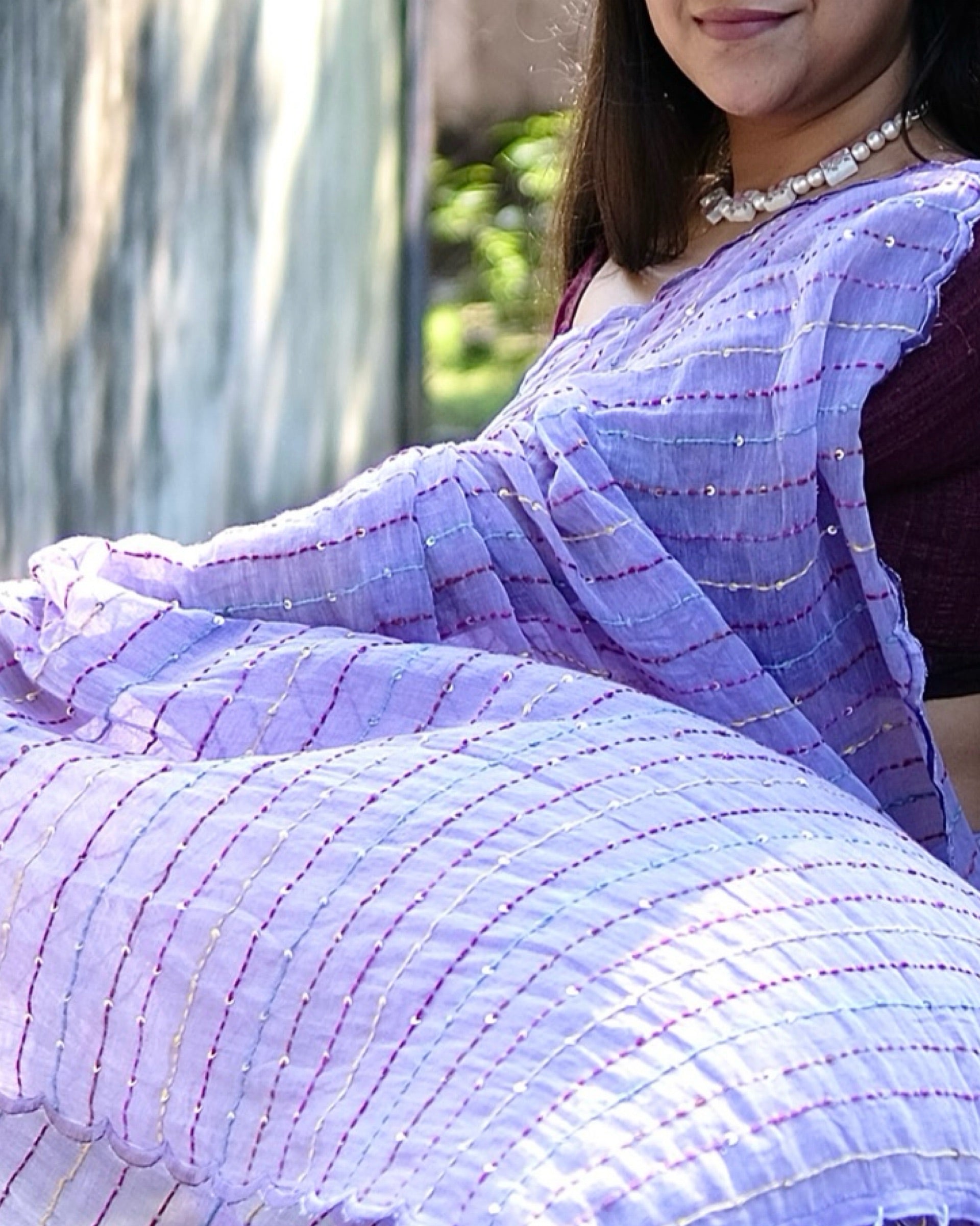 Soft and comfortable mulmul cotton saree with multicoloured embroidery in Kantha Stitch embellished with sequins perfect for party or festive occasion  in purple or violet or mauve or lavender