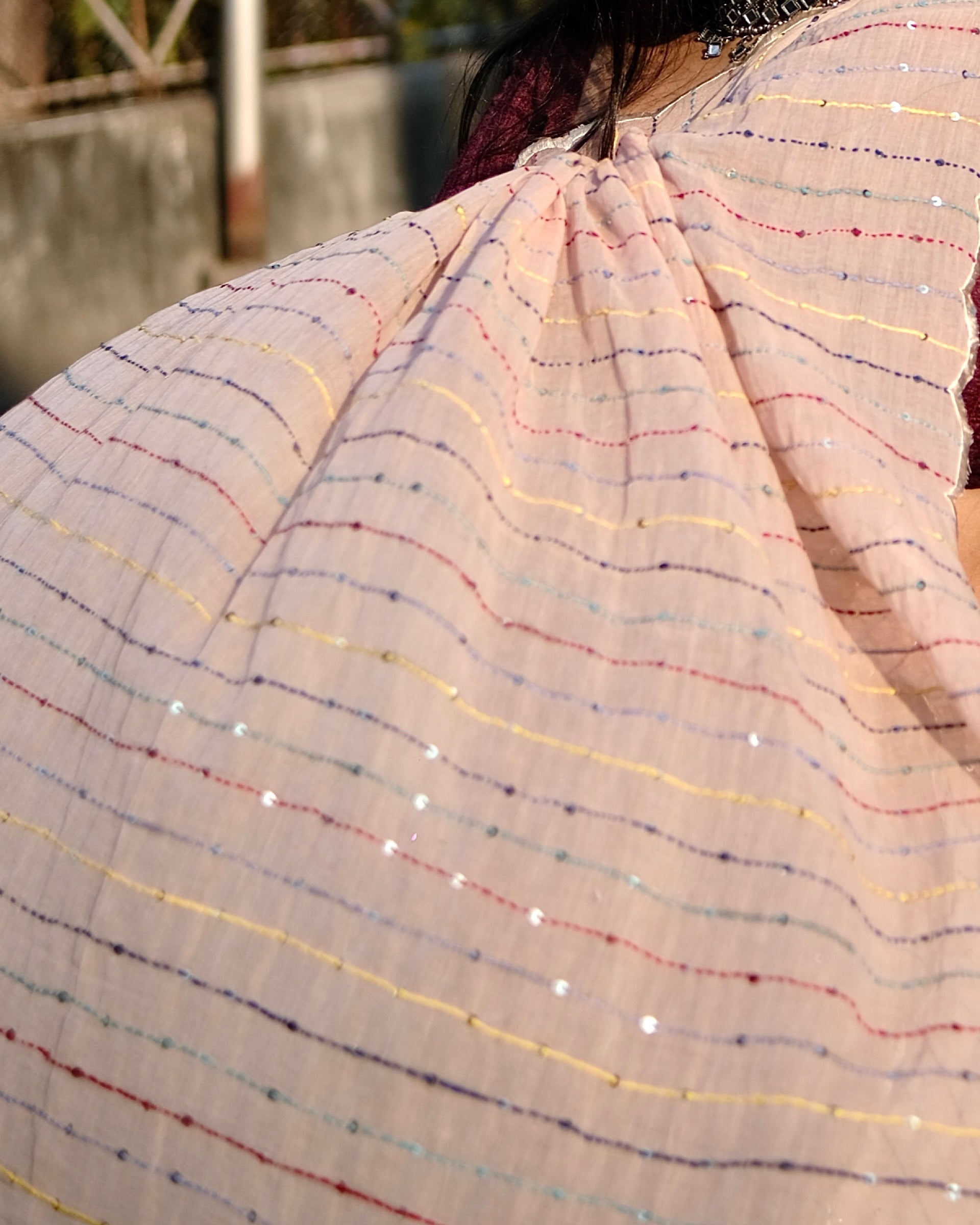 Soft and comfortable mulmul cotton saree with multicoloured embroidery in Kantha Stitch embellished with sequins perfect for party or festive occasion  in peach or beige or cream