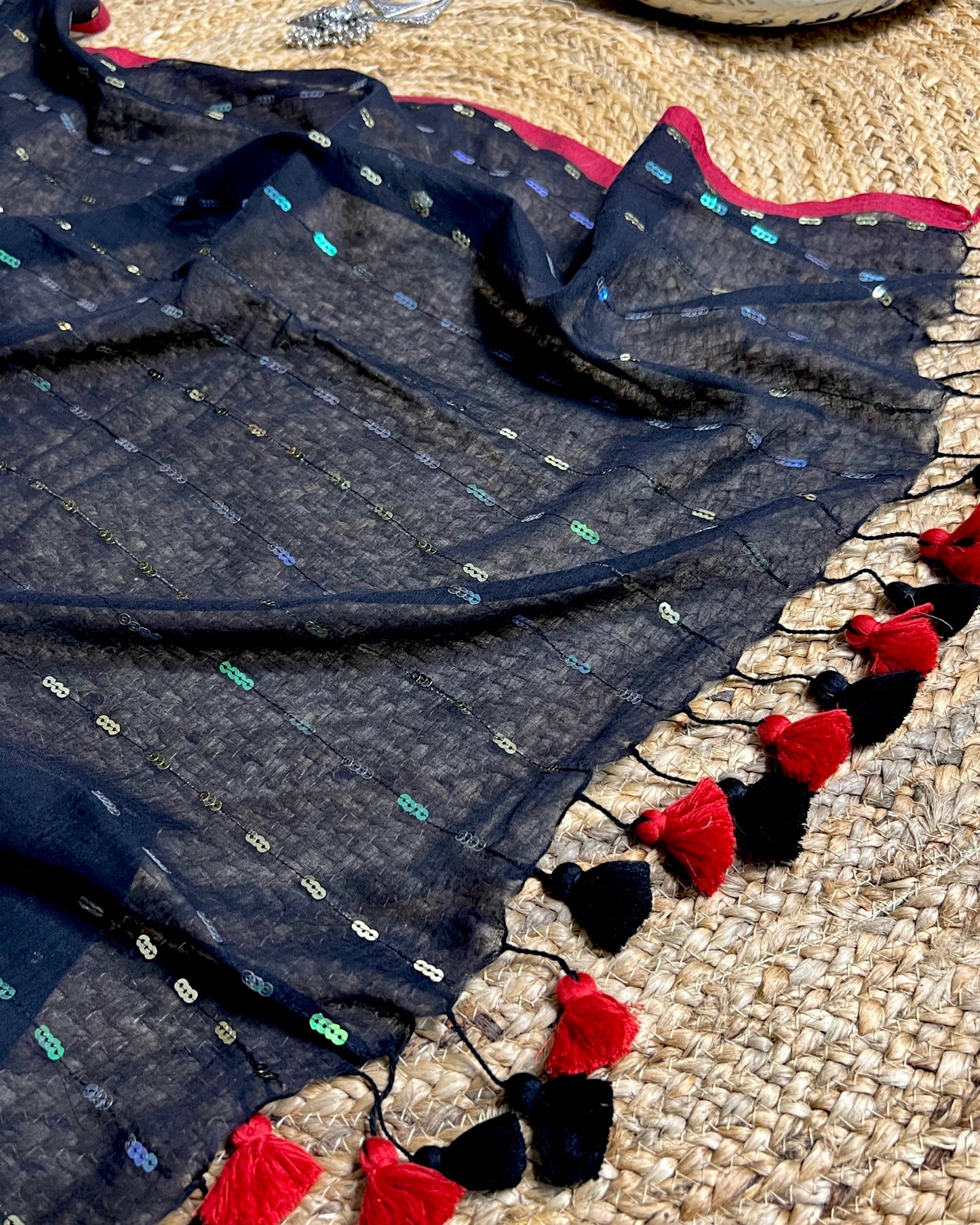 Soft and Comfortable mulmul cotton saree in black shade with sequin emblishment for festive or party wear at reasonable price