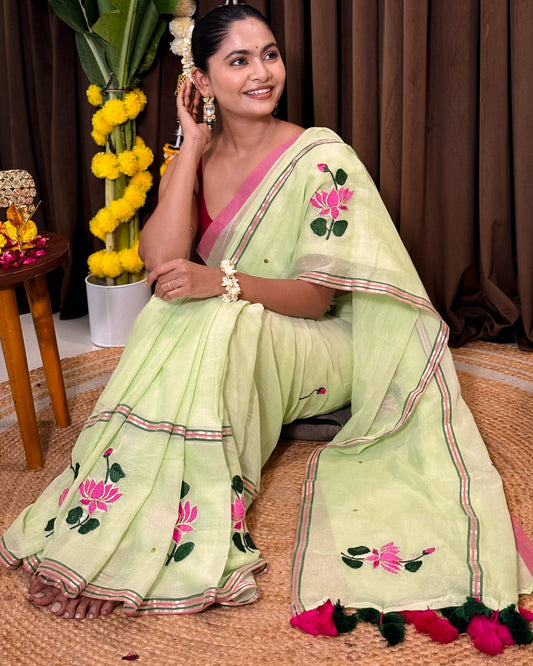 Green mulmul cotton saree with hand embroidered lotus motifs