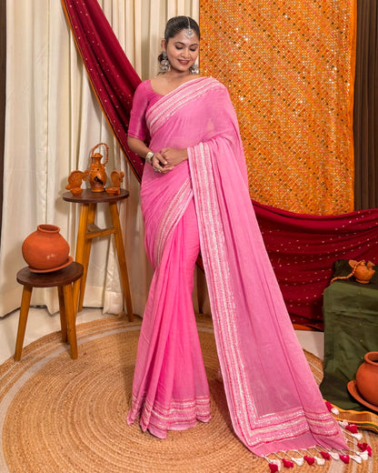 Woman in a pink mulmul cotton saree with sequins embellished border - festive saree
