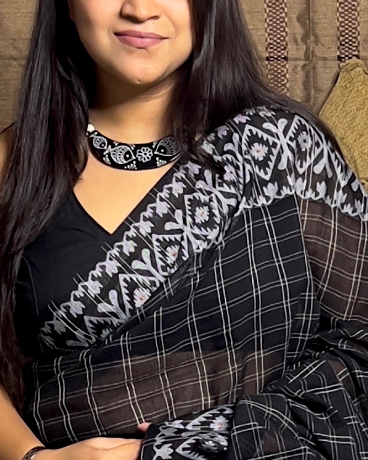 Black Khaadi sari with Jamdani white border and checks body for auspicious festivities and pujo- kalo sada