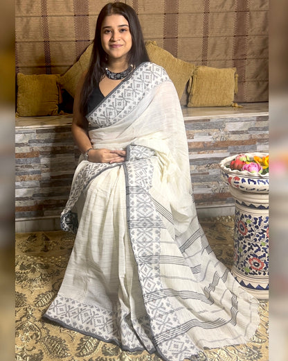 White Khaadi sari with Jamdani white border and checks body for auspicious festivities and pujo- kalo  sada