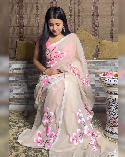 Soft and comfortable light weight white taupe mulmul cotton saree with floral hand painting good for day time wear