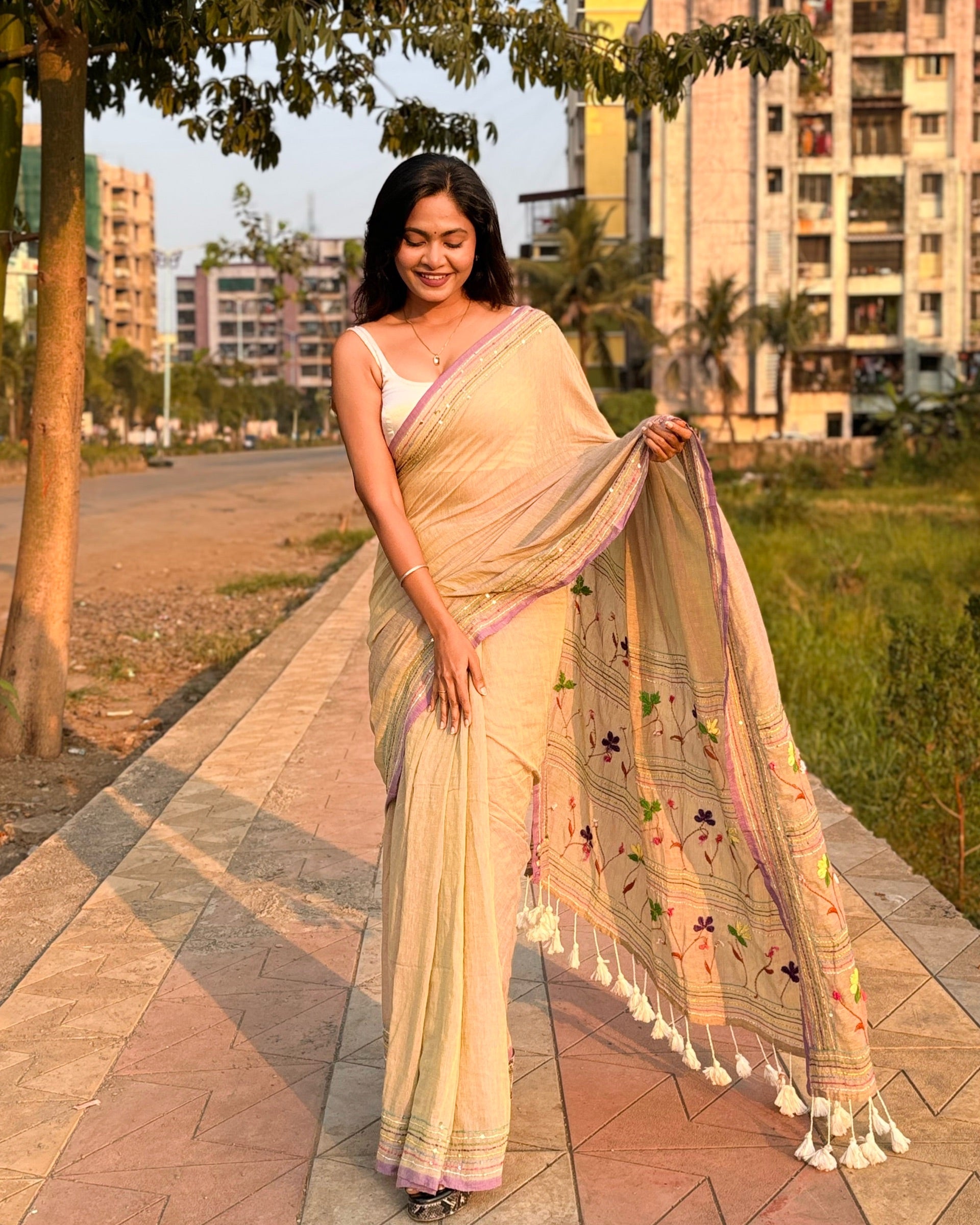 Beige embroidered mulmul cotton saree
