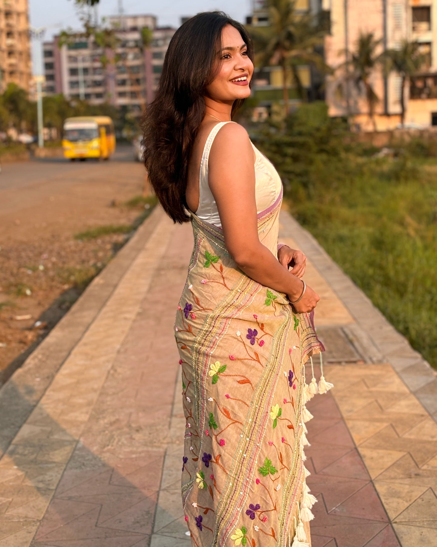 Lightweight beige embroidered mulmul saree