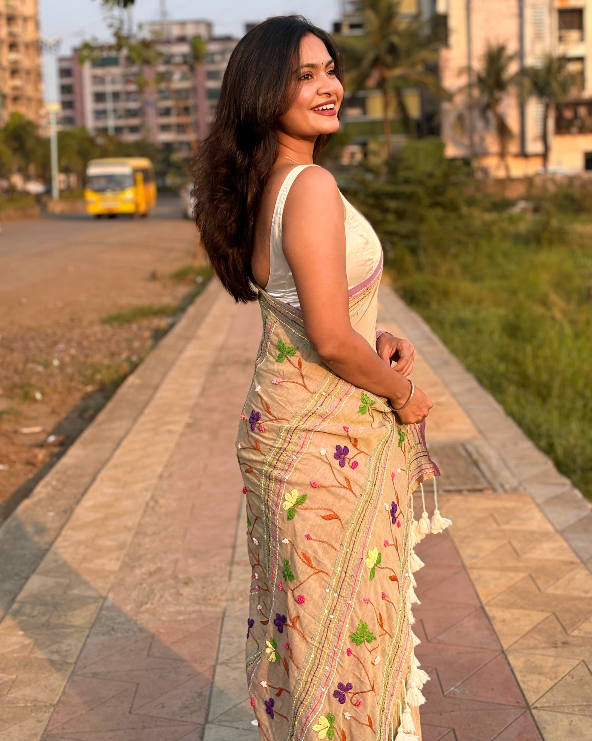 Lightweight beige embroidered mulmul saree