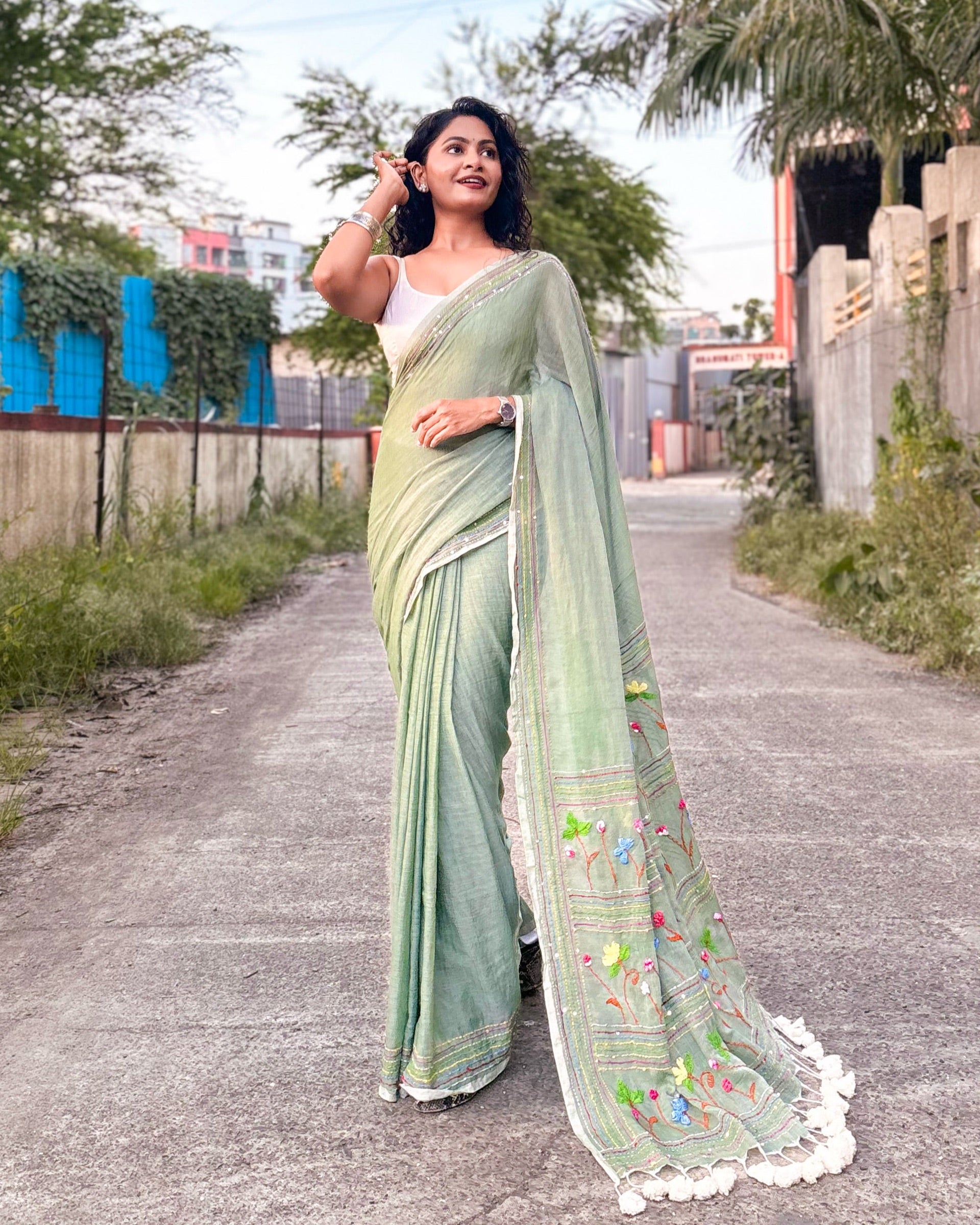Green embroidered mulmul cotton saree
