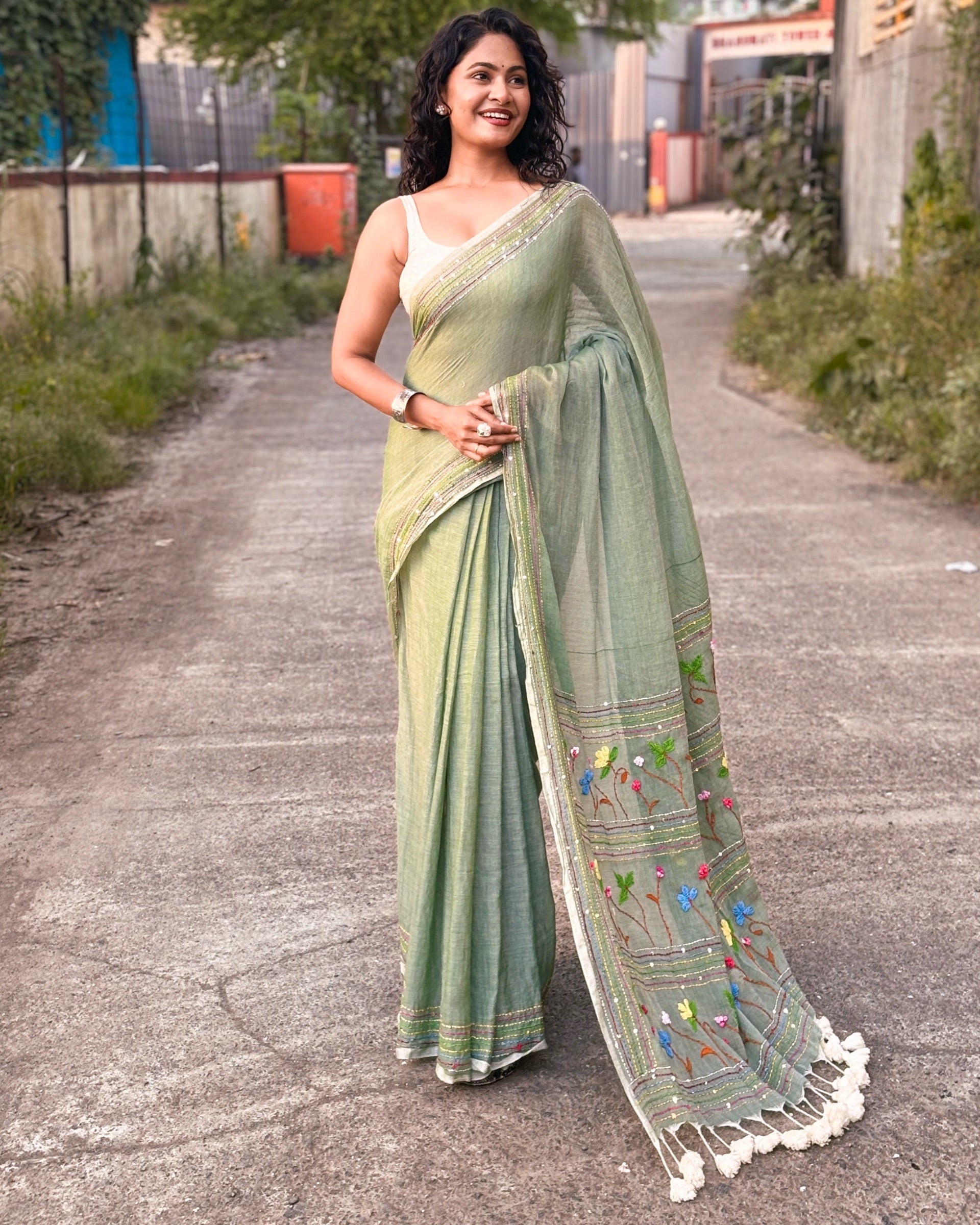 Green embroidered mulmul cotton saree