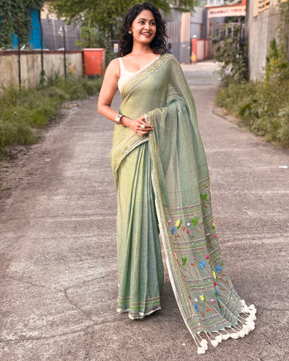Green embroidered mulmul cotton saree