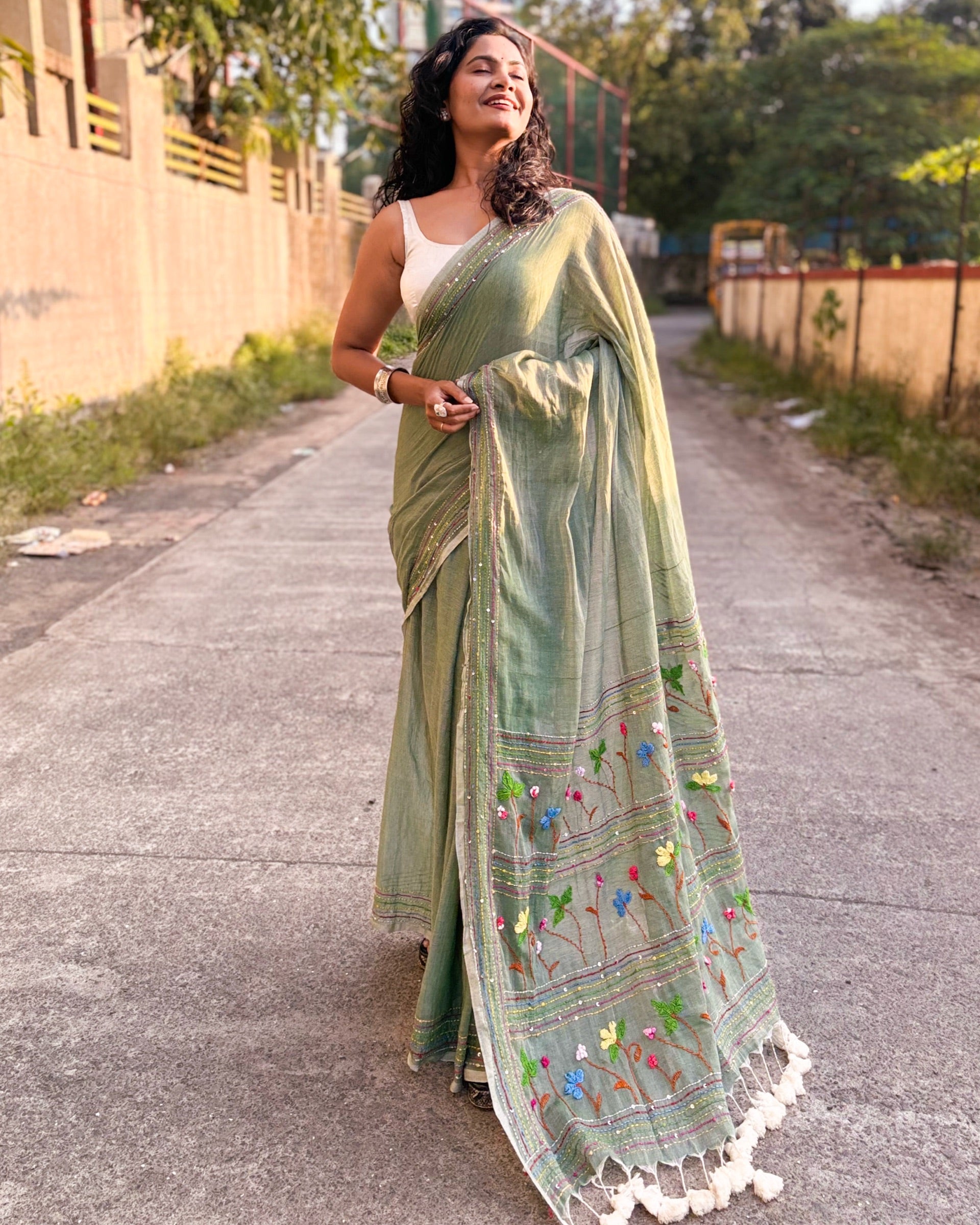 Green embroidered mulmul cotton saree