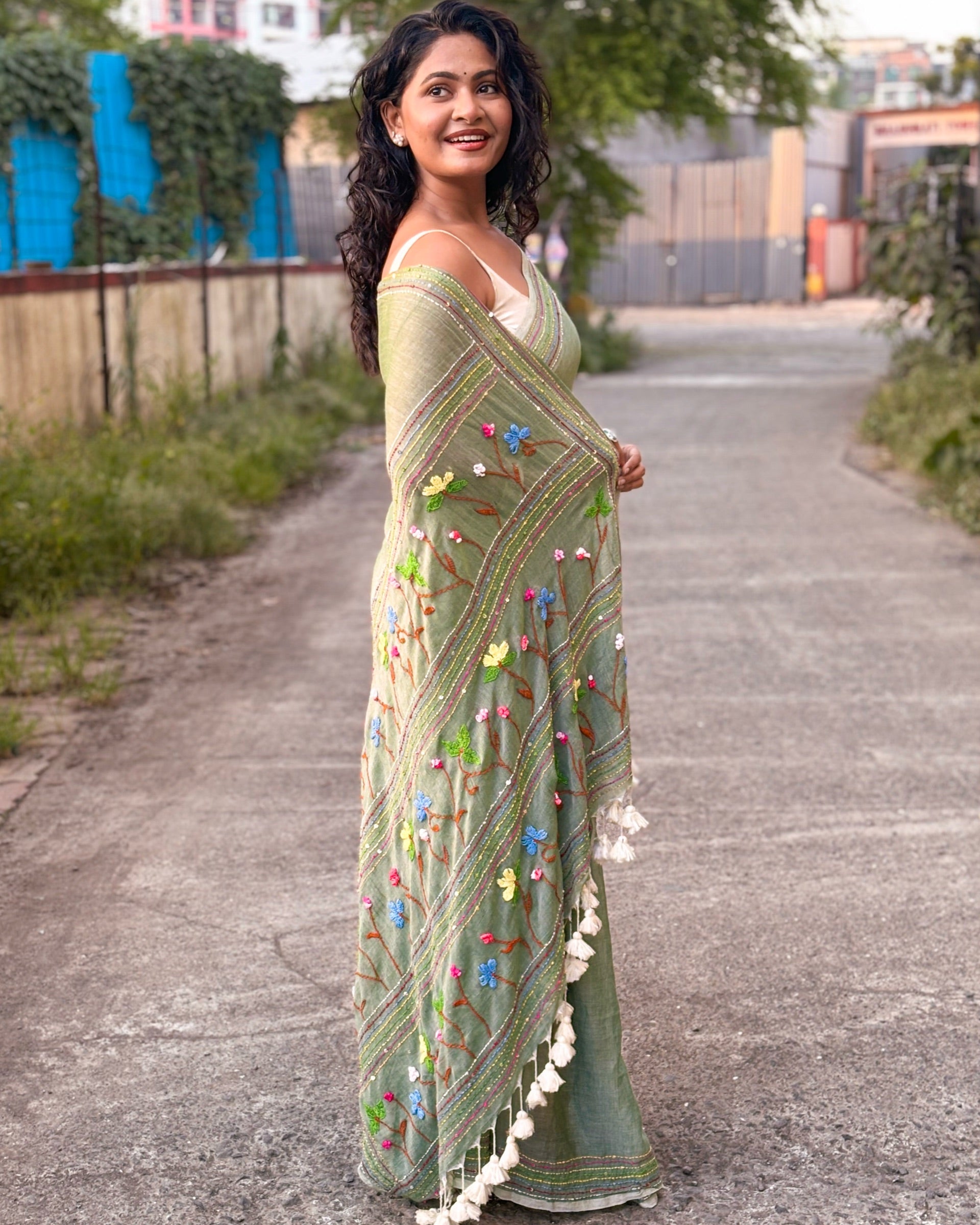 Green embroidered mulmul cotton saree