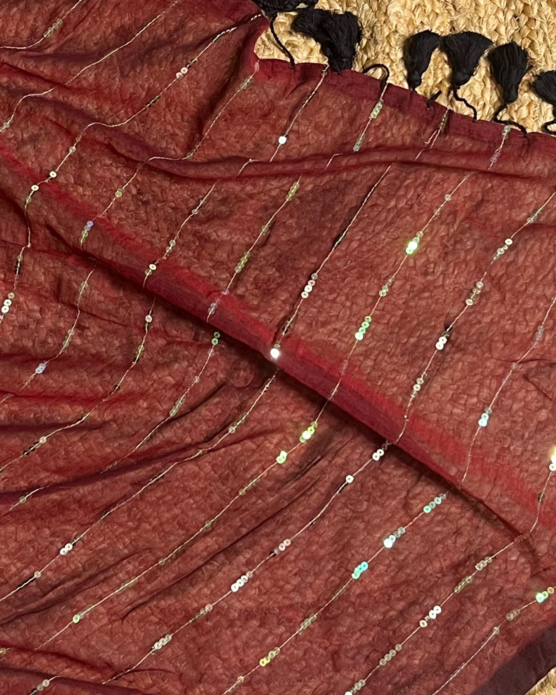 Soft and Comfortable mulmul cotton saree in maroon shade with sequin emblishment for festive or party wear at reasonable price