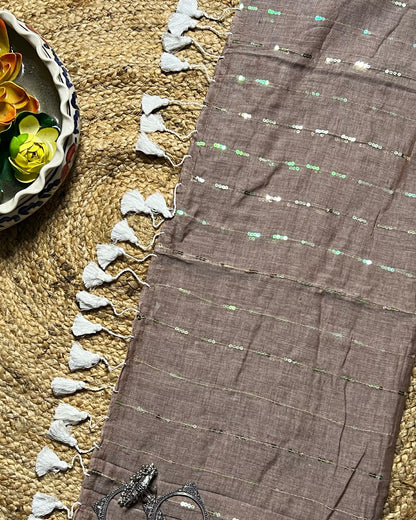 Soft and Comfortable mulmul cotton saree in grey taupe shade with sequin emblishment for festive or party wear at reasonable price