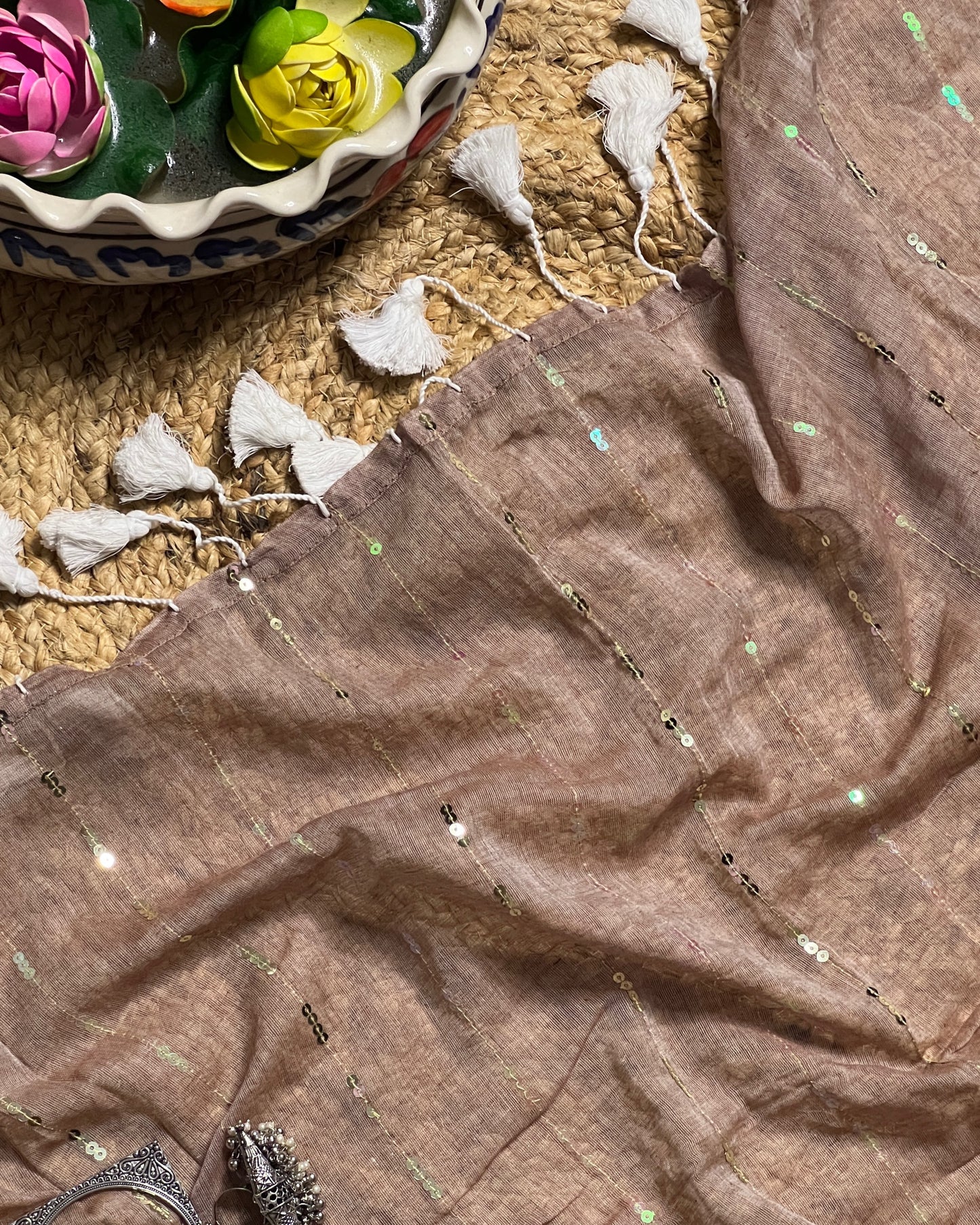 Soft and Comfortable mulmul cotton saree in grey taupe shade with sequin emblishment for festive or party wear at reasonable price