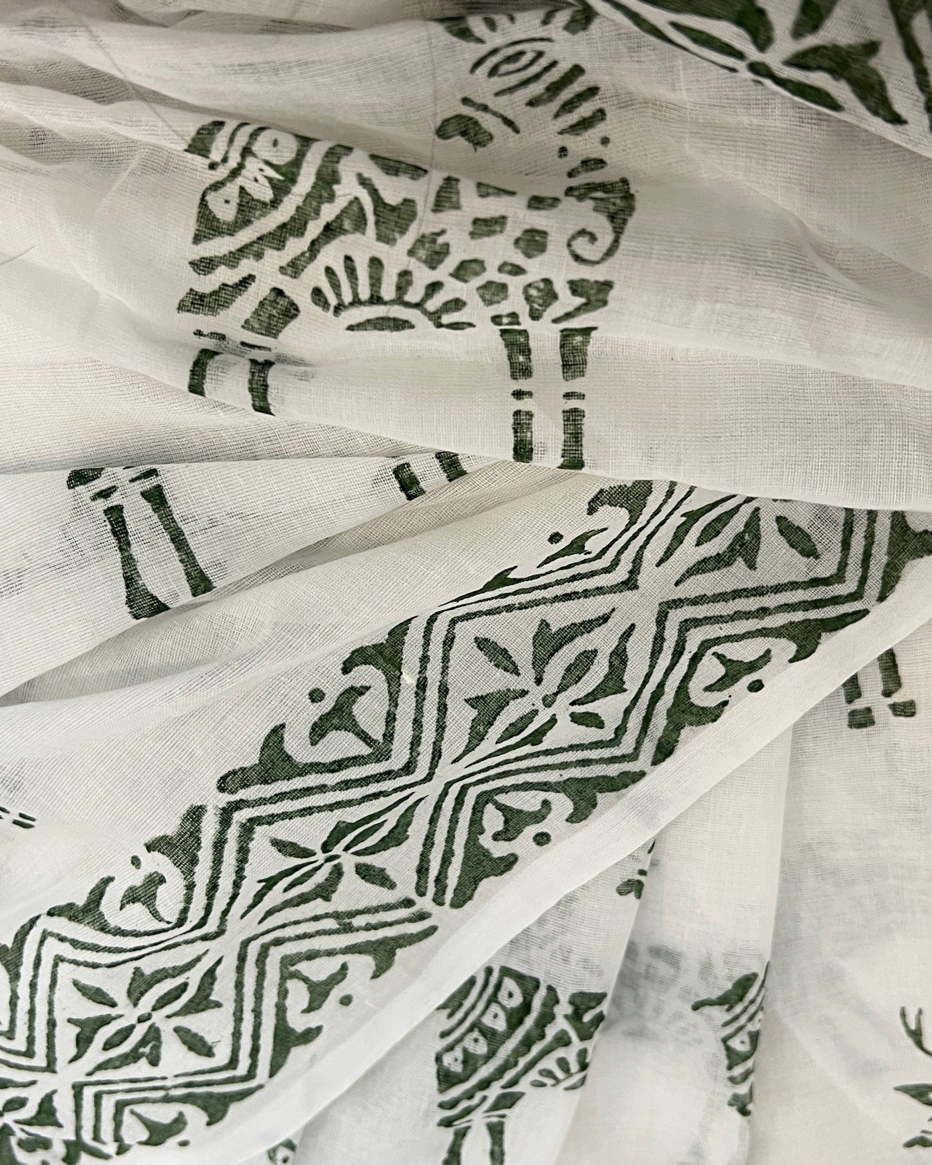 Soft & Comfortable white mulmul saree with handblock print in green deer pattern