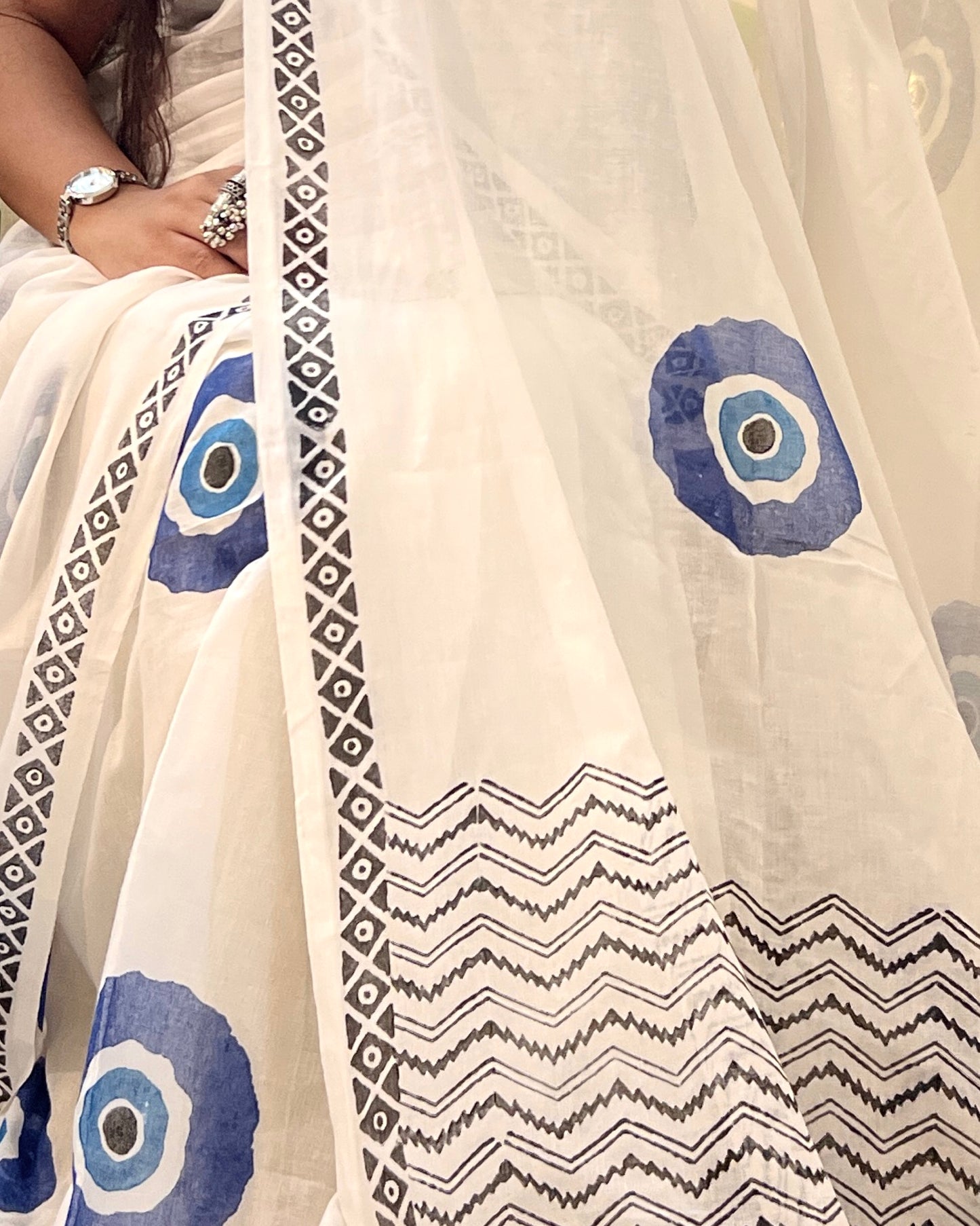 Soft & Comfortable white mulmul saree with handblock print in blue evil eye  pattern